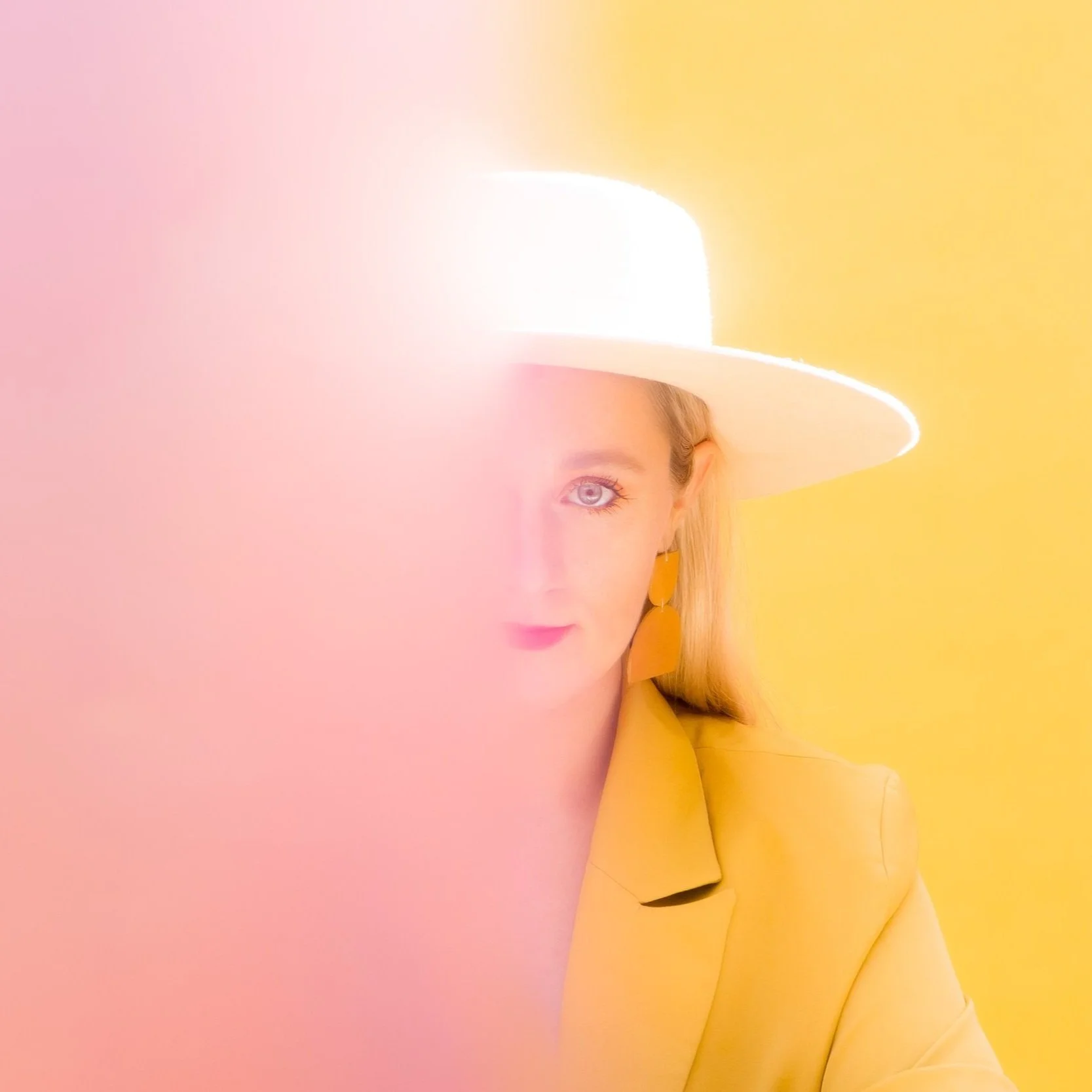 modern creative headshot colorful blond female entrepreneur