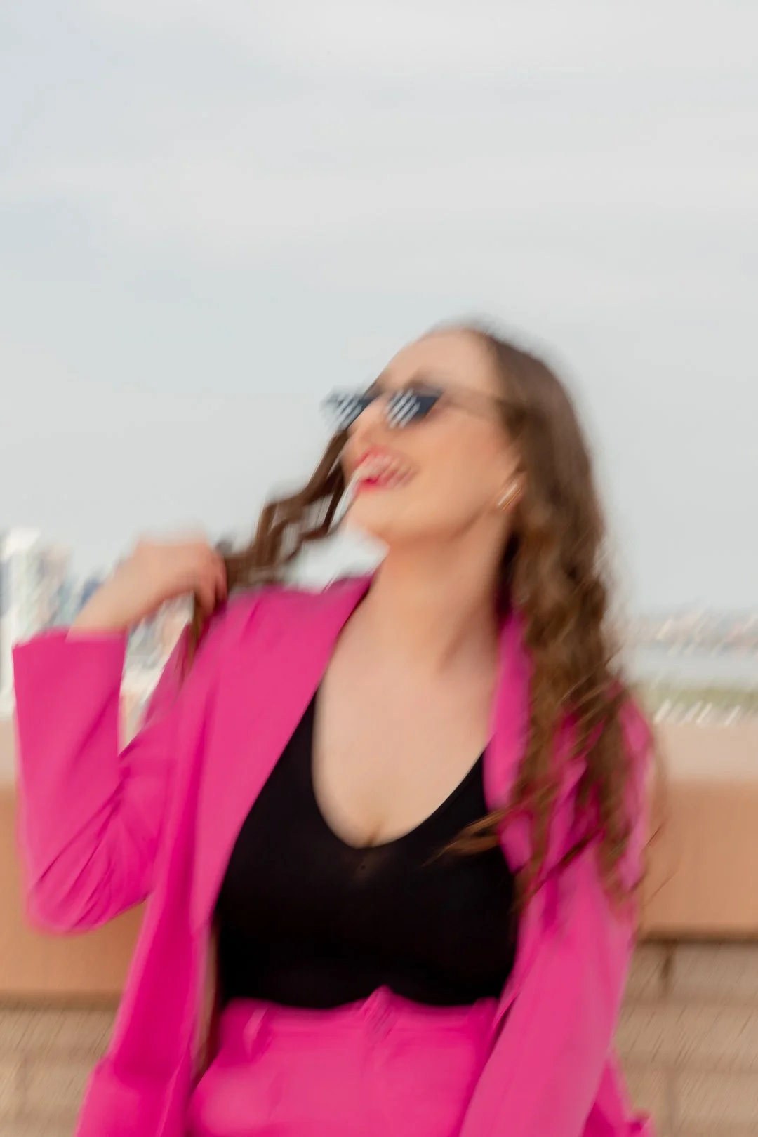 san diego branding photography of a creative graphic designer in a pink suit and editorial style