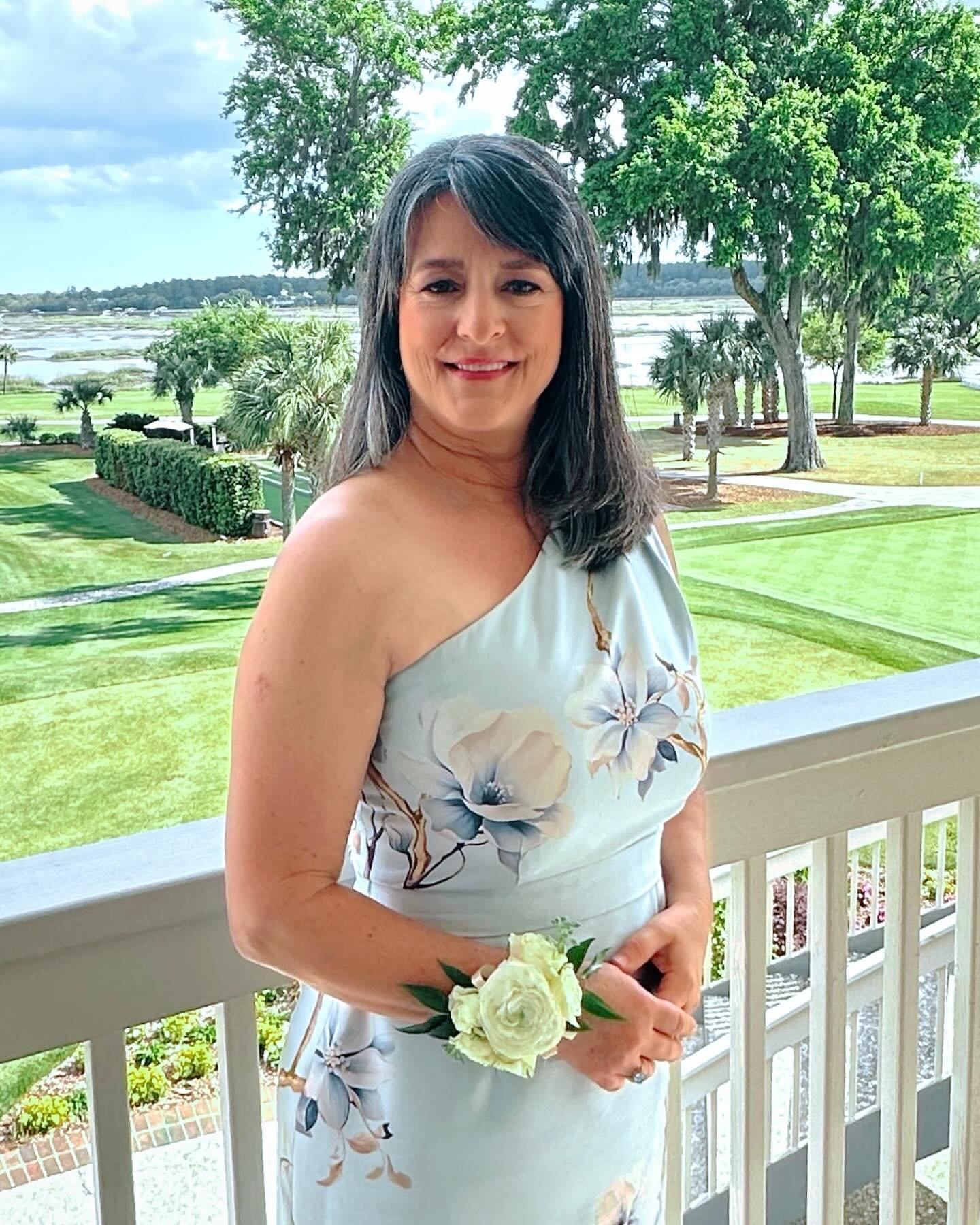 A vibrant floral print under the Carolina sun. This custom one-shoulder dress was designed for charm and comfort, reflecting the joy of the occasion✨

.
.
#wildflowerwonder #customgown #custom #motherofthebride #designer #momofthebride #weddingdress 