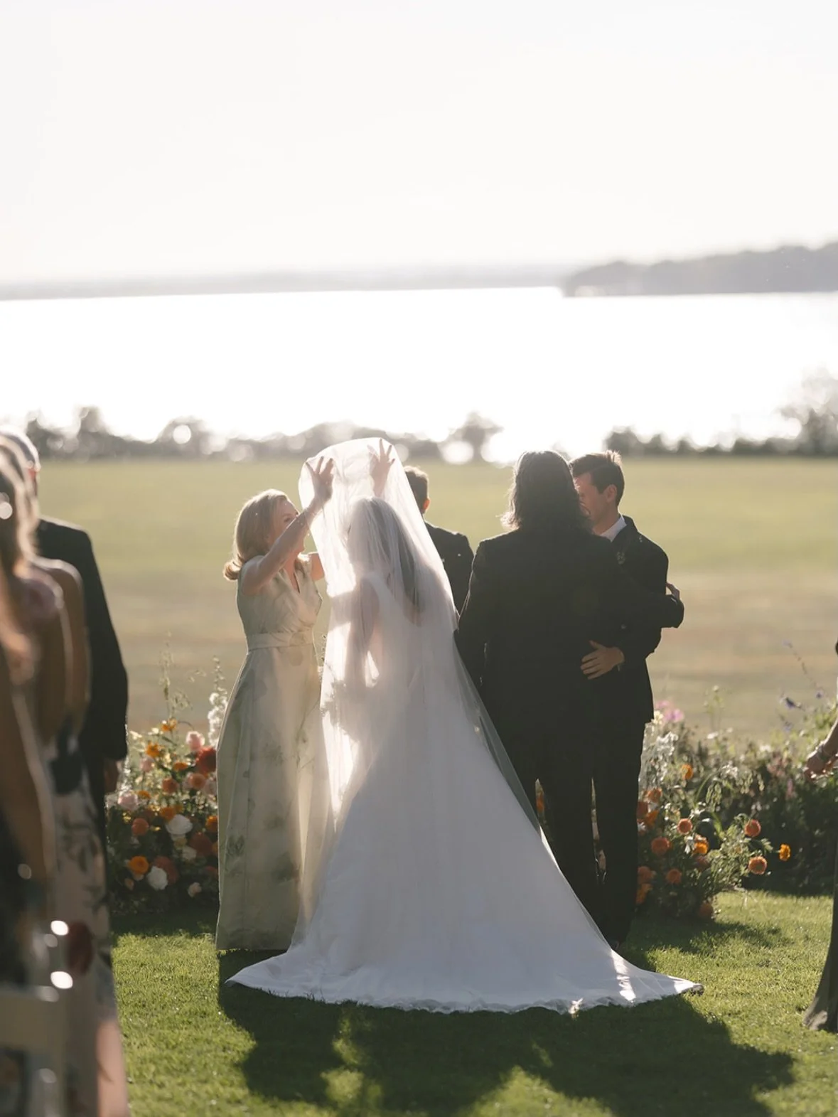 Golden light, open air, and a ceremony filled with feeling. The beauty of a wedding isn&rsquo;t only in the aisle &mdash; it&rsquo;s in the presence of the women who shaped the day. 
Get started on your own bespoke mother of the bride gown at gramerc
