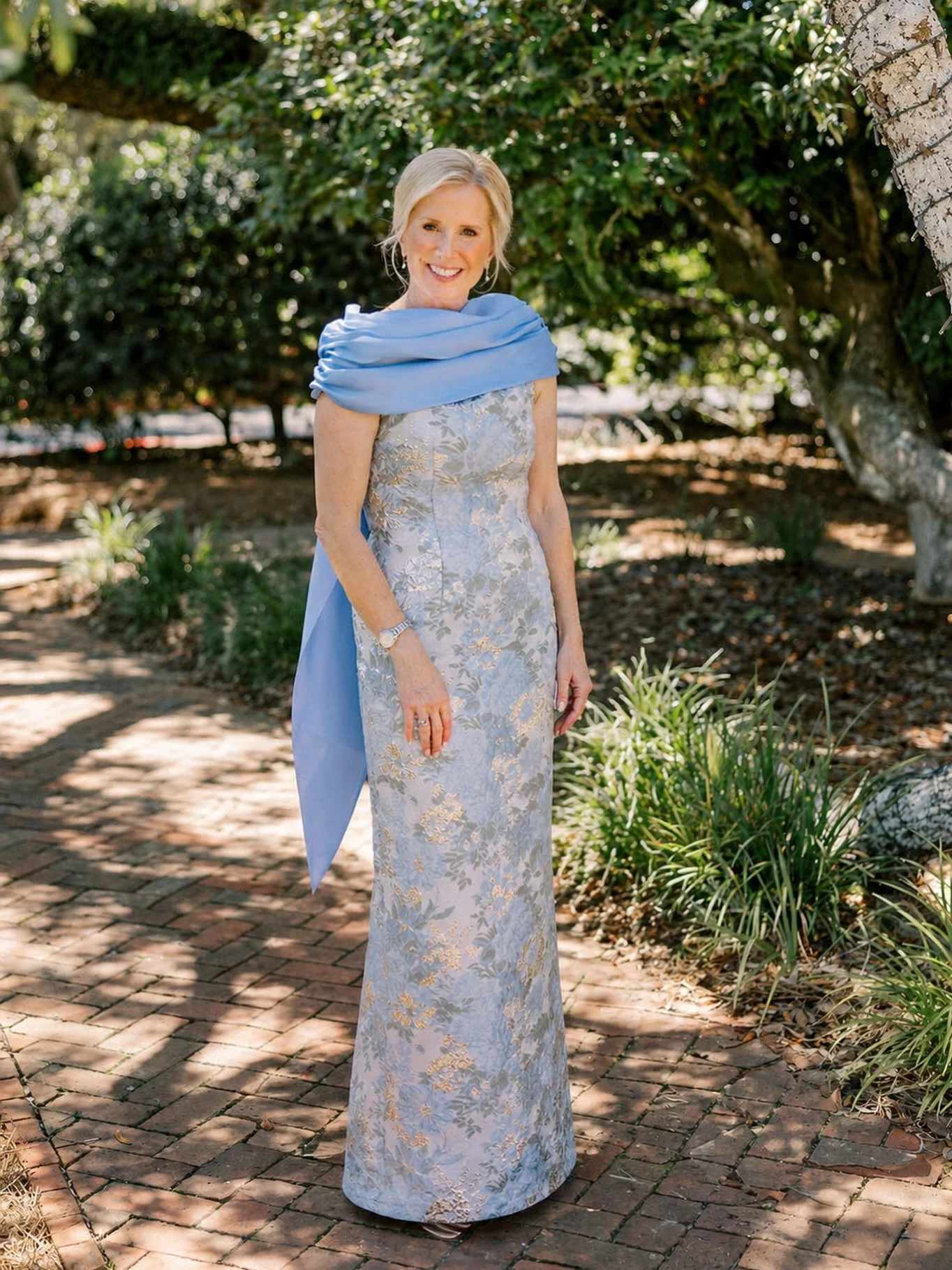 A soft statement for spring and summer celebrations. We created this beautiful mother&rsquo;s gown in a custom light blue brocade paired with a matching shawl, thoughtfully designed to feel elegant, effortless, and entirely her own for such a special