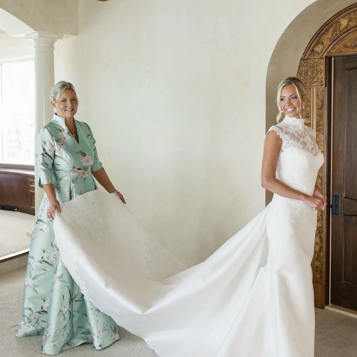 Melinda Pierce wearing a mint-green floral mother of the bride gown with three-quarter sleeves, designed by Gramercy Atelier