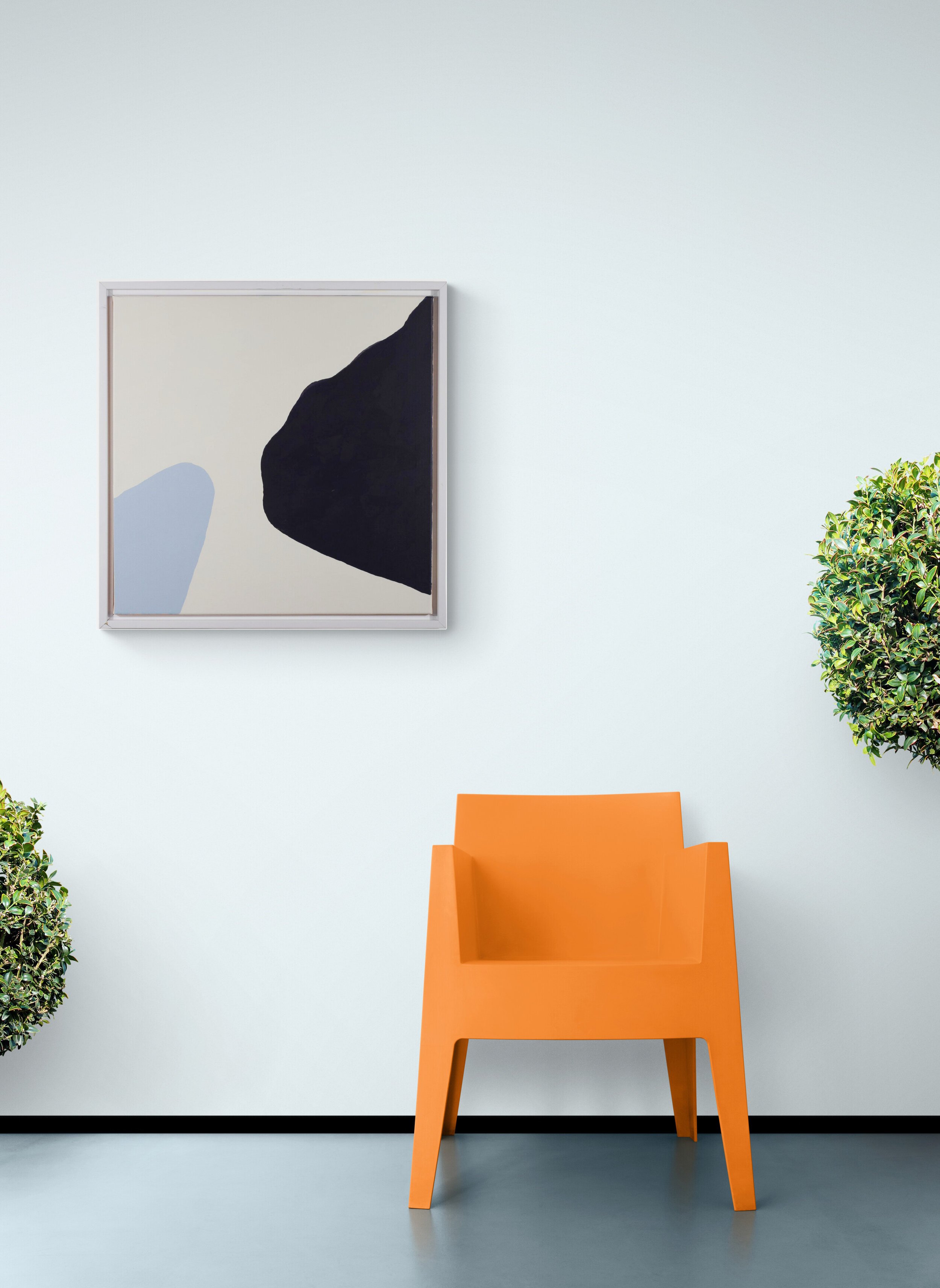 Contemporary_chair_and_topiary_plants.jpg