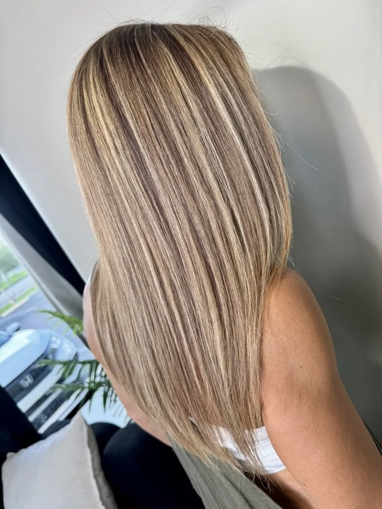 Long straight blonde hair with K-Tip extensions in the studio