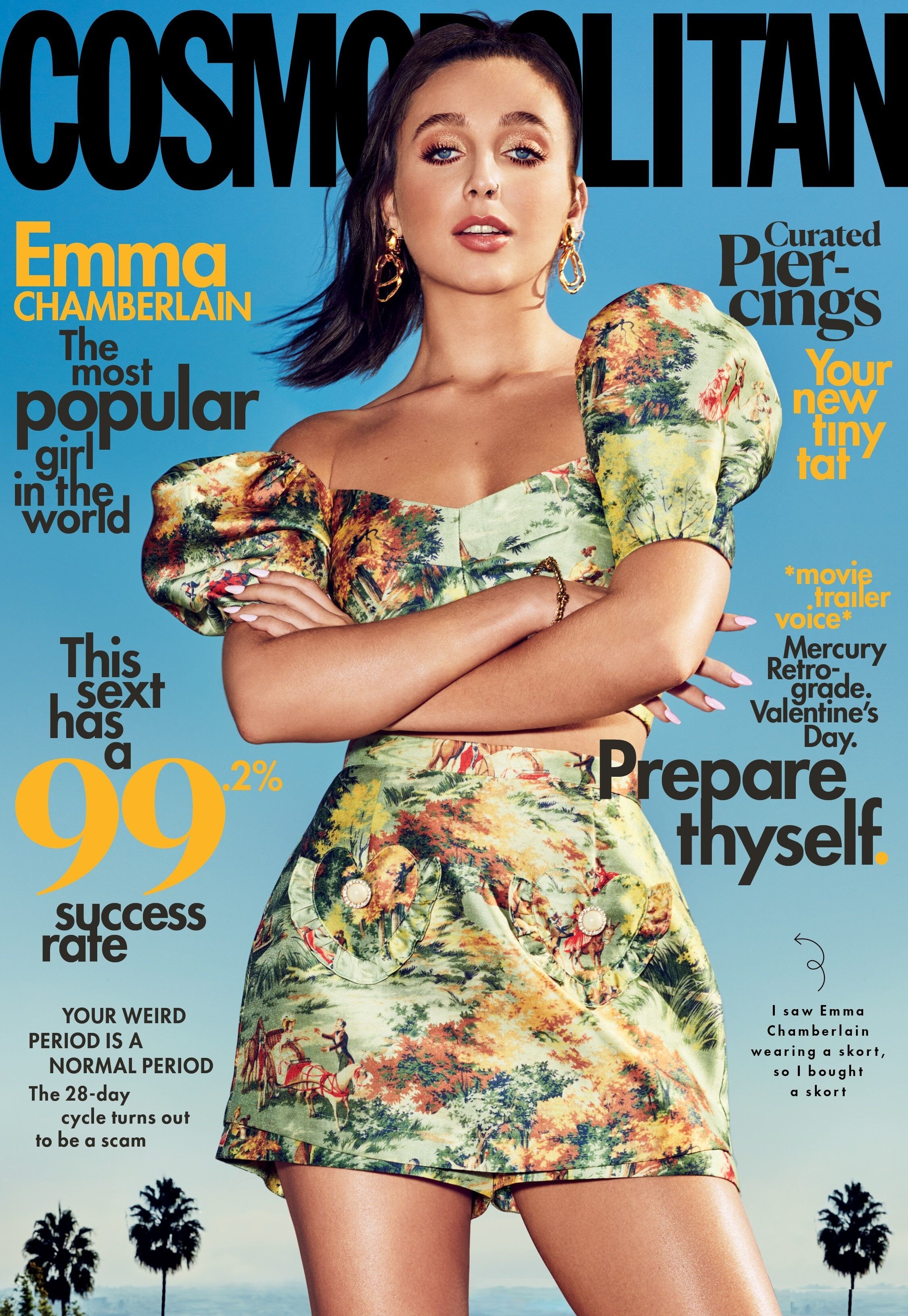 Cover of Cosmopolitan magazine featuring Emma Chamberlain in a floral outfit with palm trees in the background.