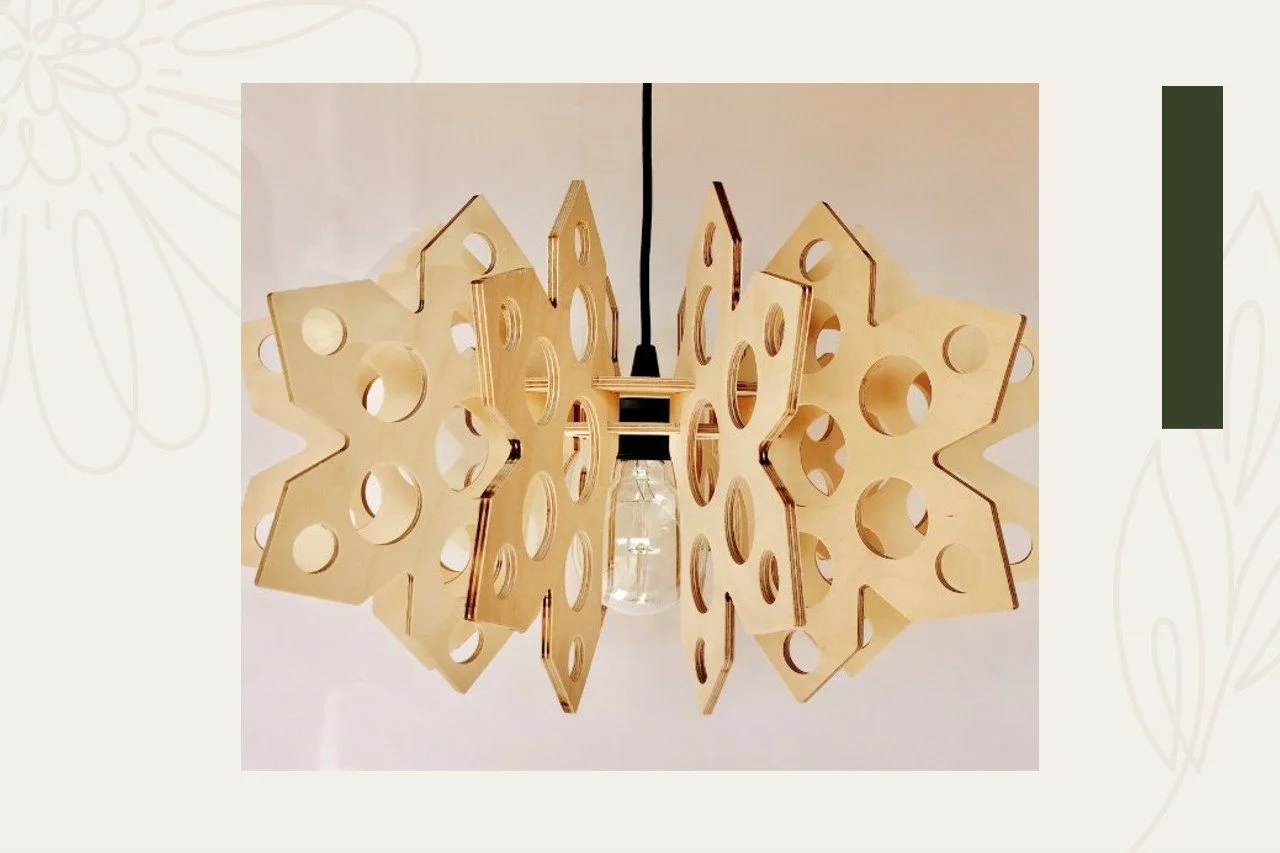 A pendant light fixture made of multiple wooden panels with circular cutouts arranged in a geometric pattern, with a single exposed light bulb hanging in the center.