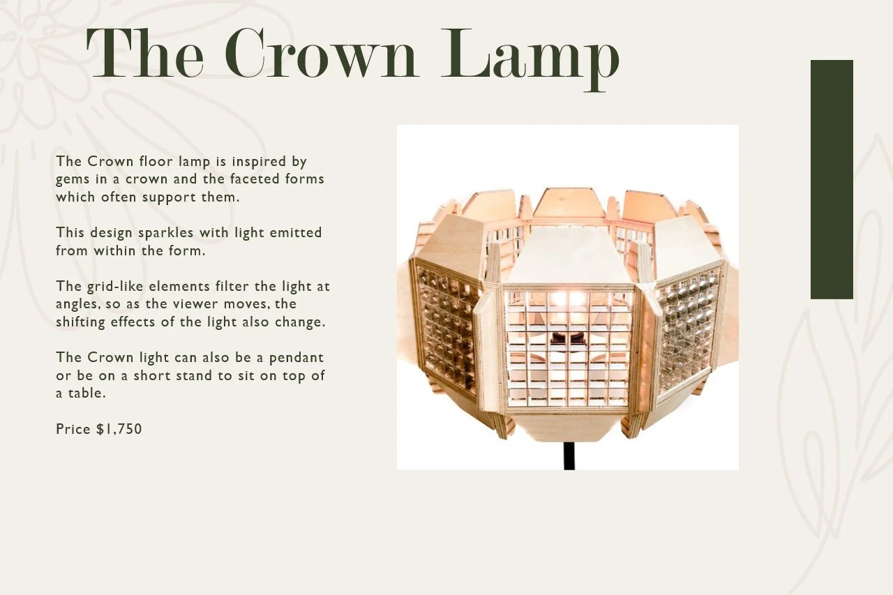 Photo of a crown-shaped lamp with faceted gem-like forms, made of wood and glass, on a white background.