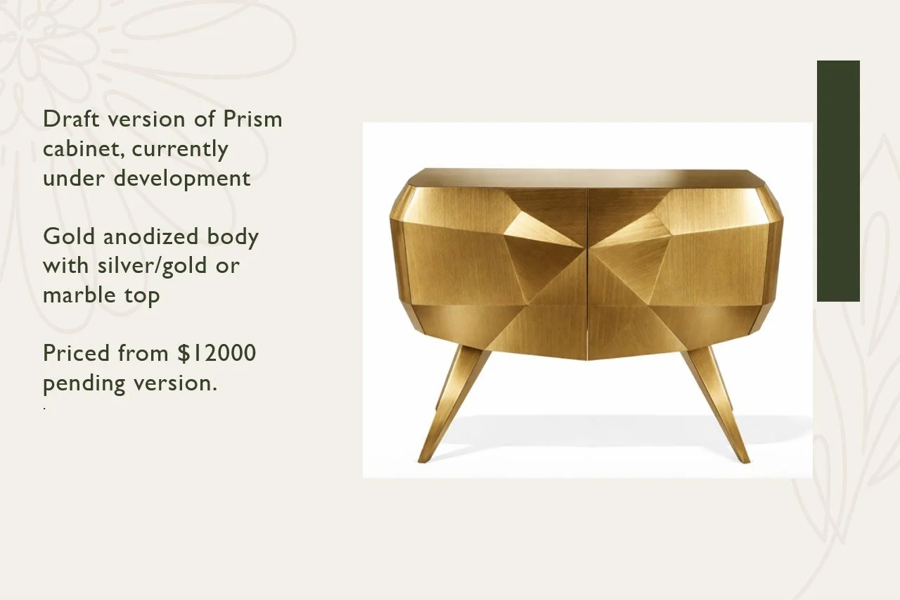 A gold-colored, geometric-style cabinet with a marble top and angled legs
