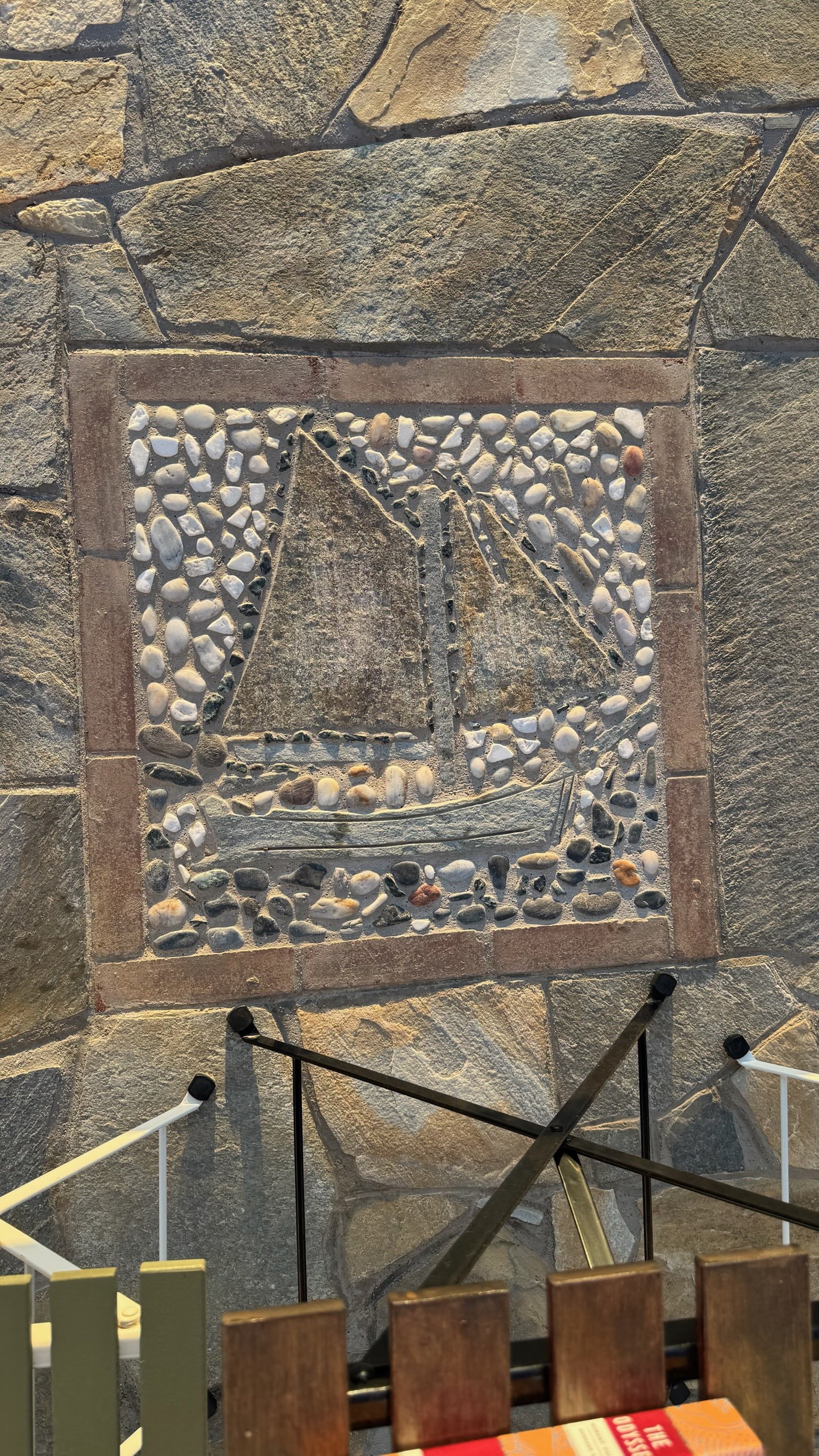 Ikaria, pebble-mosaic inlay set into a fieldstone wall
