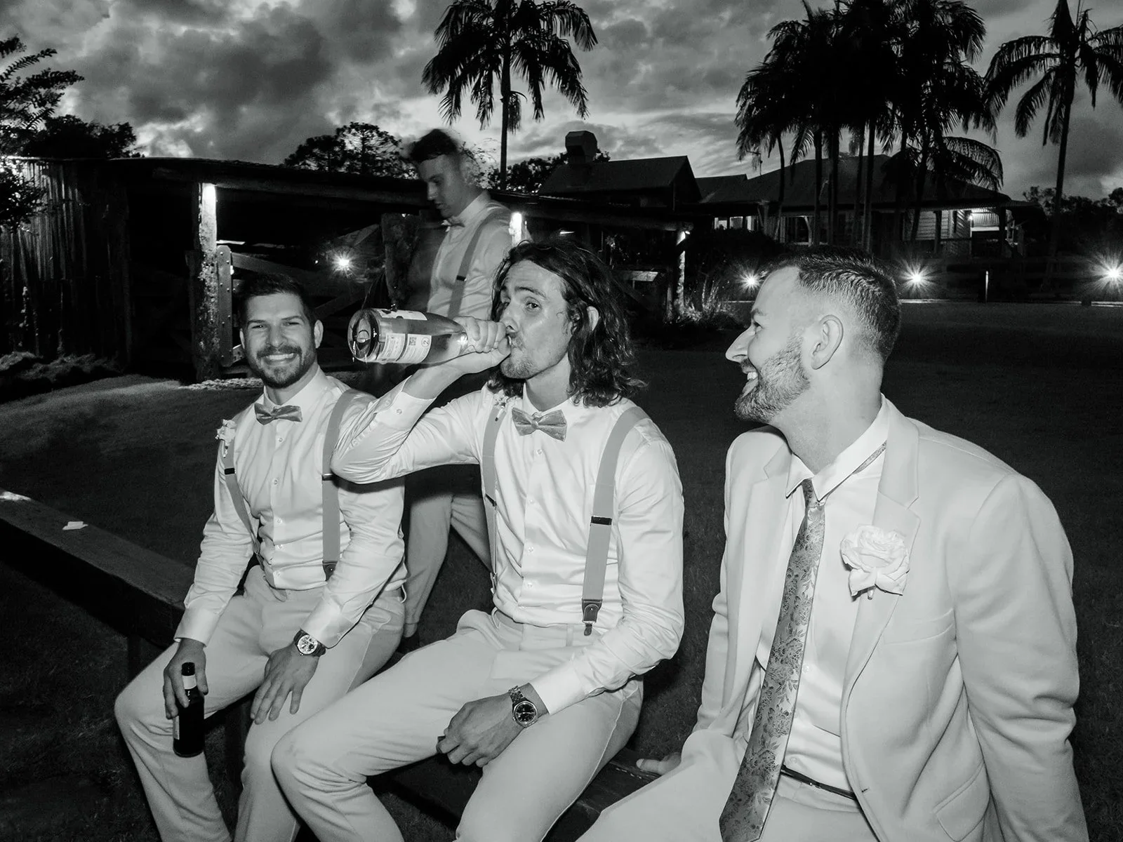 Groomsmen laughing together outside the venue in the evening — Sean Reefman Photography