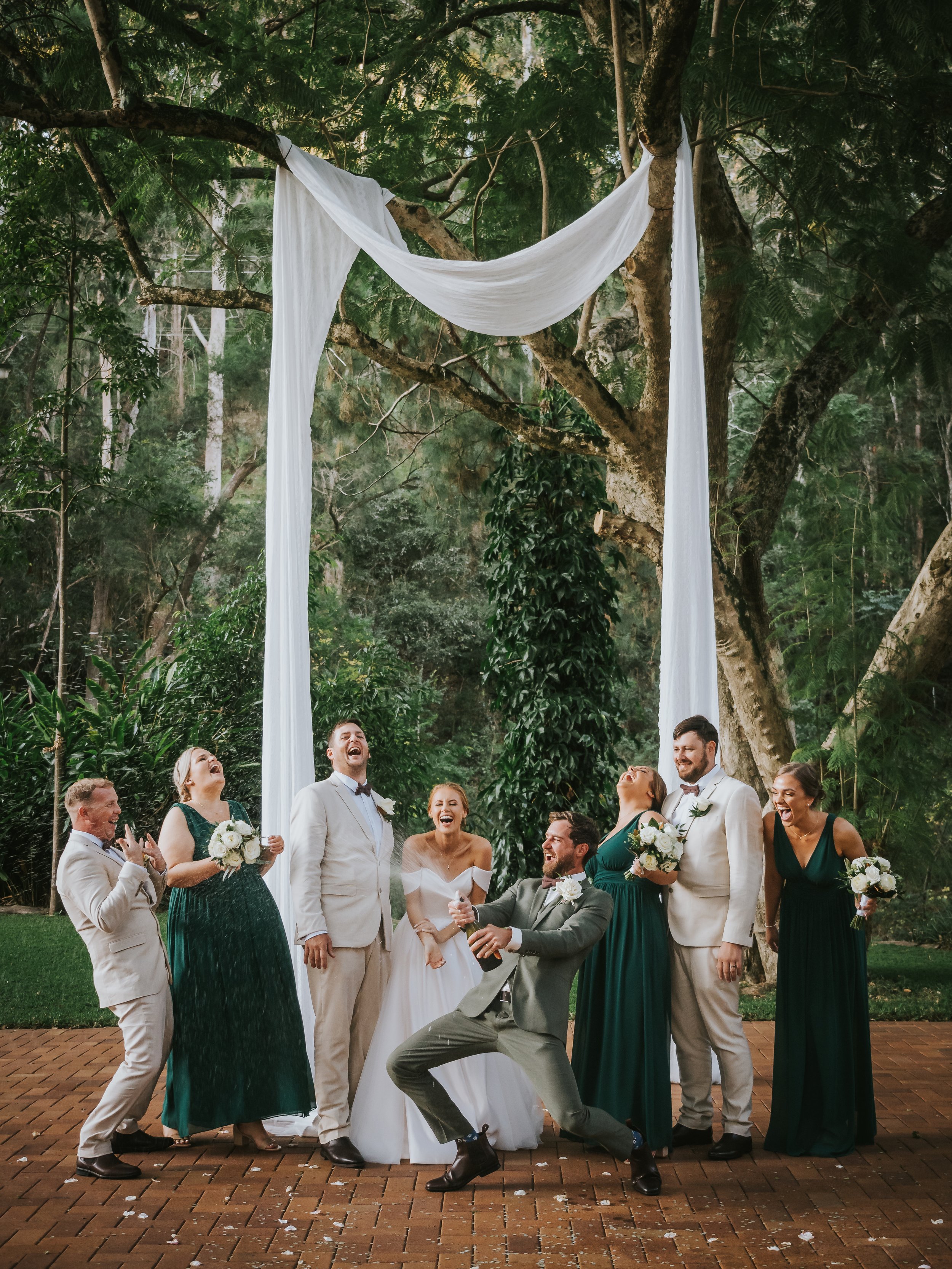 Champagne spray Brisbane Bundaleer Rainforest Gardens Wedding.jpg