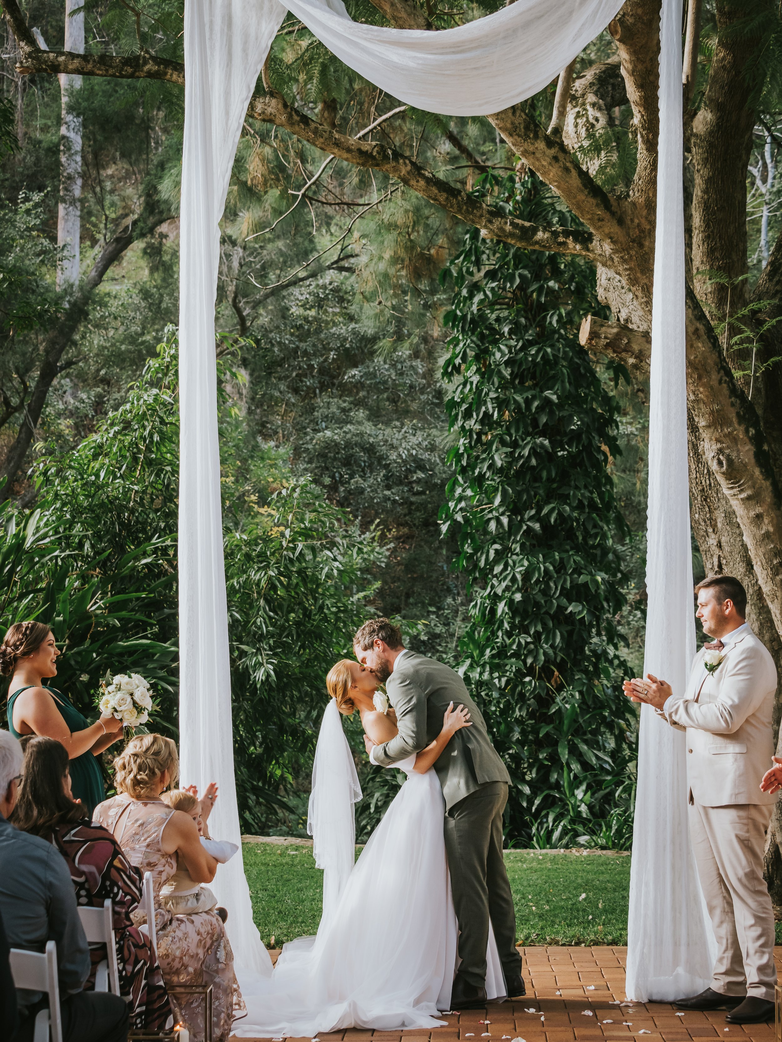 FIRST KISS Brisbane Bundaleer Rainforest Gardens Wedding.jpg