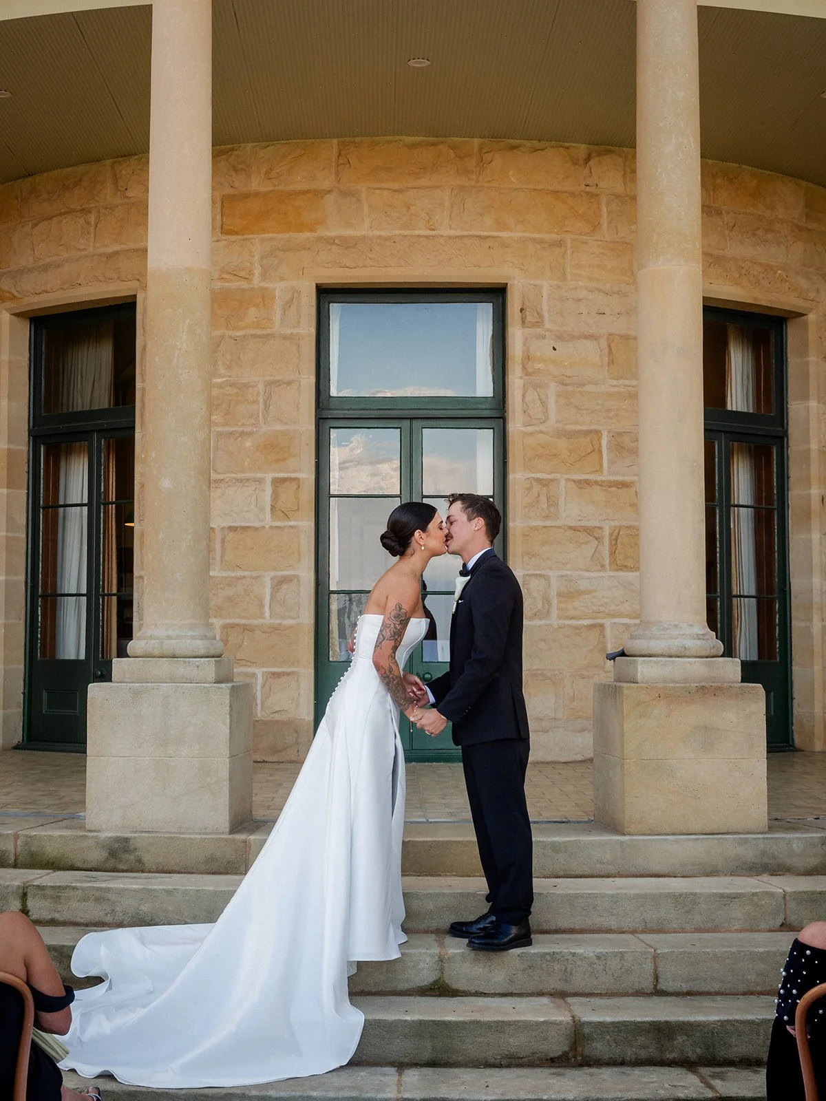 Cherry and Nick's first kiss at the altar on the steps of Jimbour House — Darling Downs wedding by Sean Reefman Photography