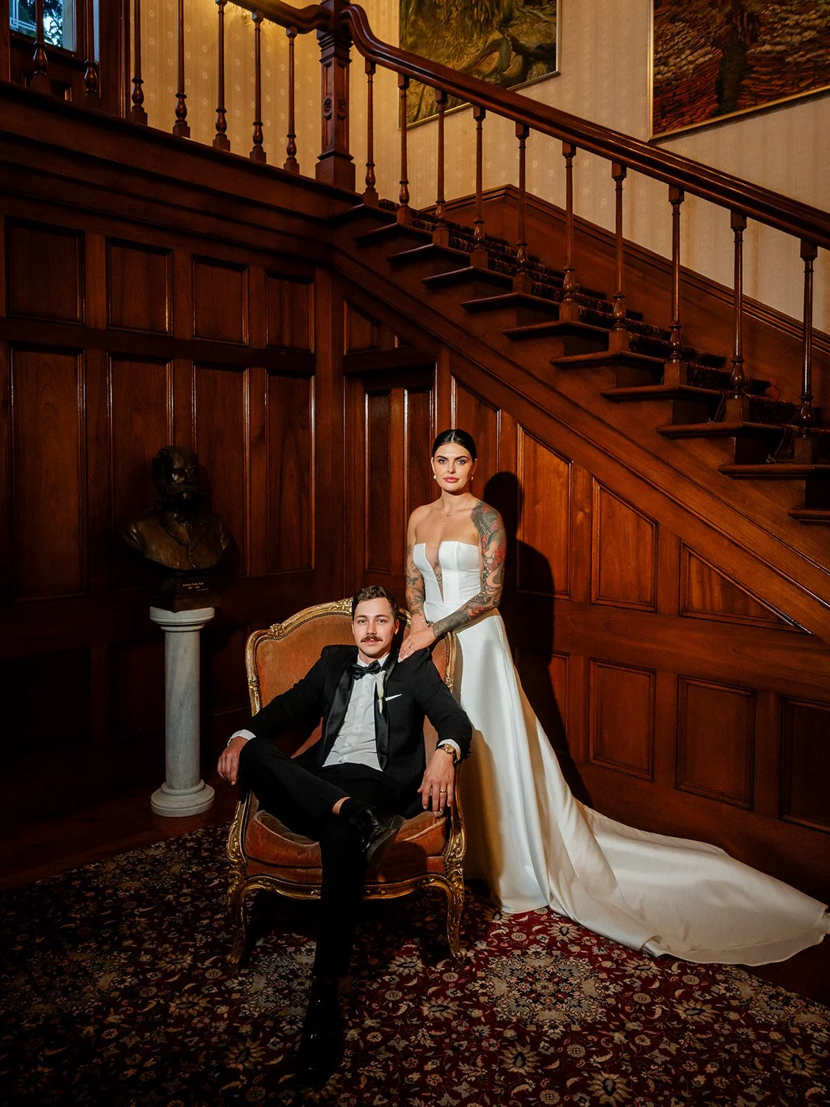 Cherry and Nick portrait inside Jimbour House with Nick seated in ornate chair and Cherry standing behind — Sean Reefman Photography