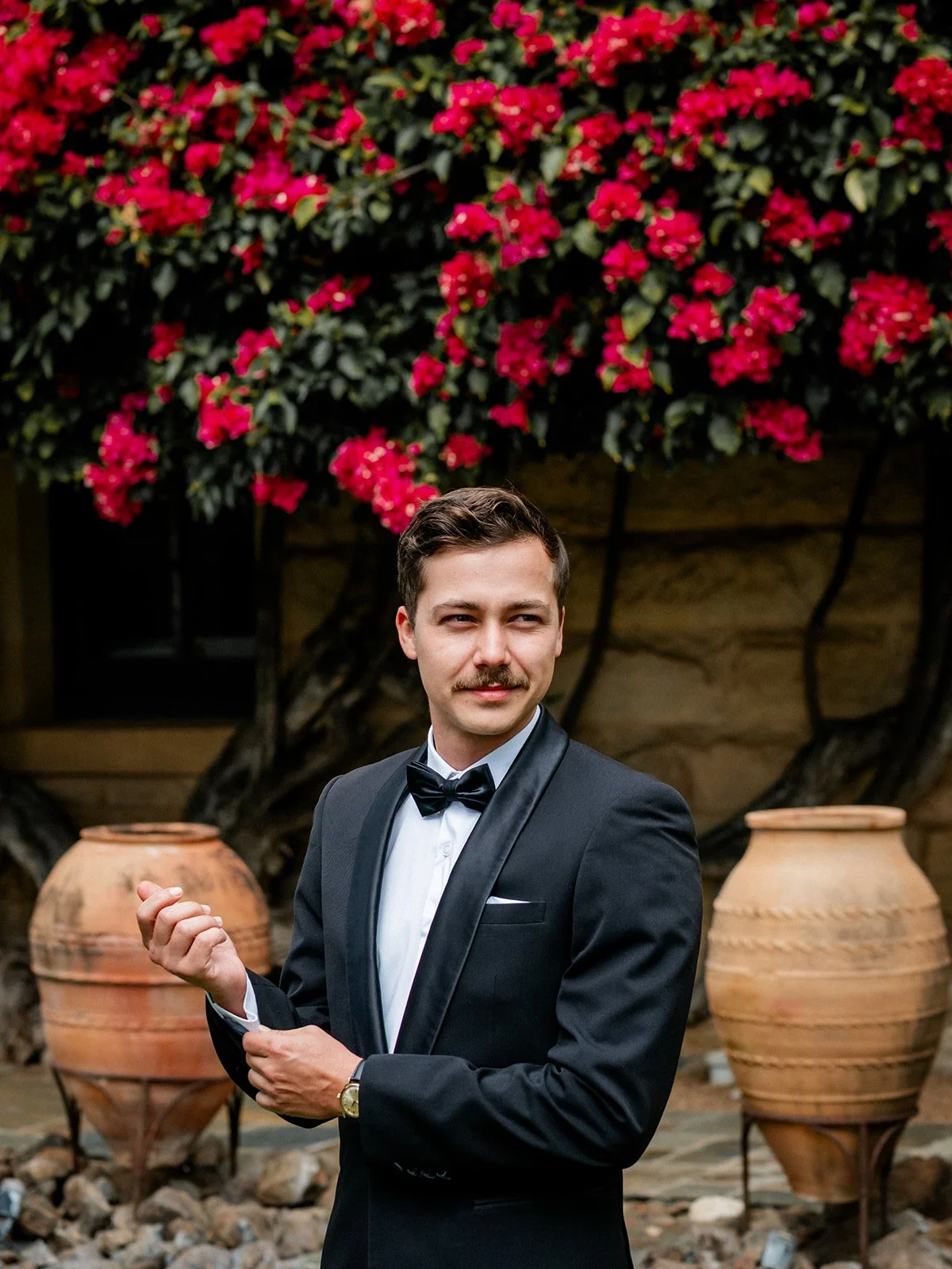 Nick the groom portrait outside Jimbour House bougainvillea facade — Darling Downs wedding by Sean Reefman Photography