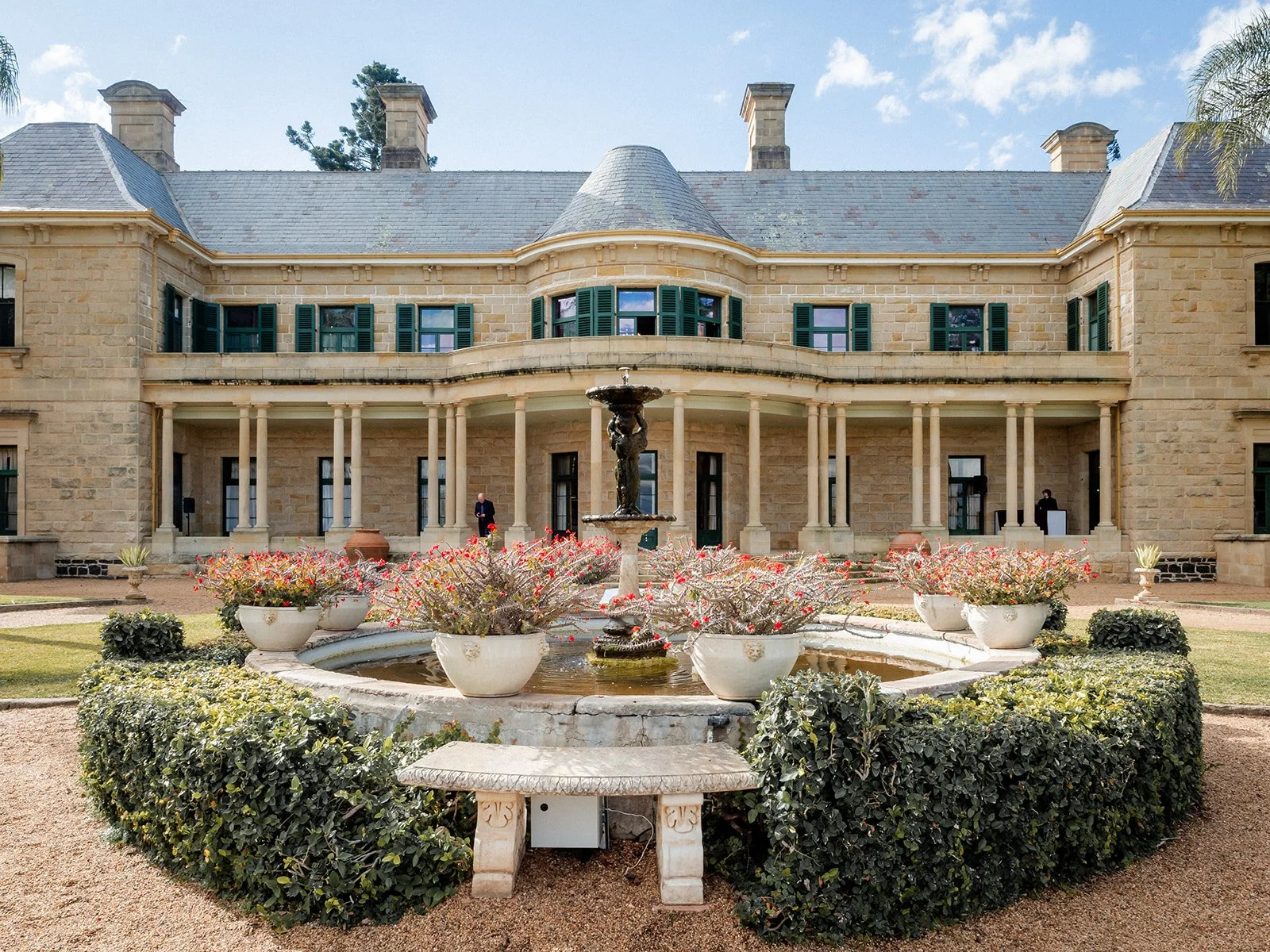 Jimbour House fountain and formal gardens with sandstone mansion facade — Darling Downs wedding venue by Sean Reefman Photography