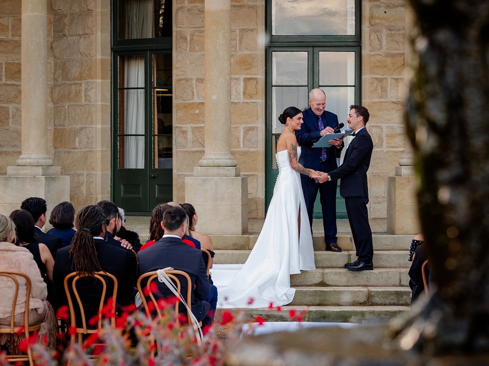 Cherry and Nick exchanging vows at outdoor ceremony on Jimbour House steps — Sean Reefman Photography