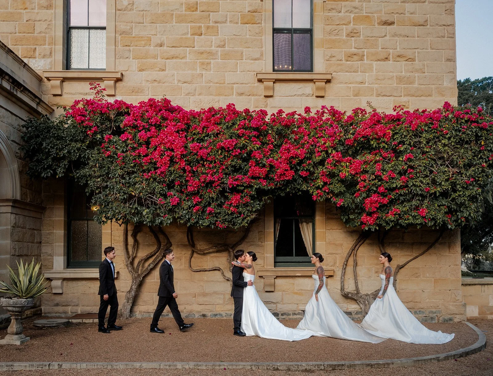 Cherry & Nick outside Jimbour House sandstone facade with red bougainvillea — Sean Reefman Photography