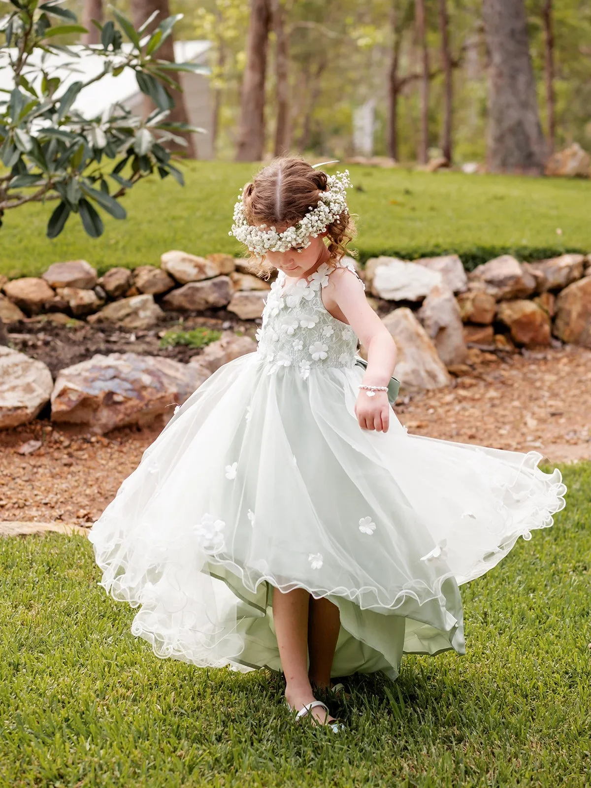 Flower girl running across the lawn in her white dress and floral crown — Sean Reefman Photography