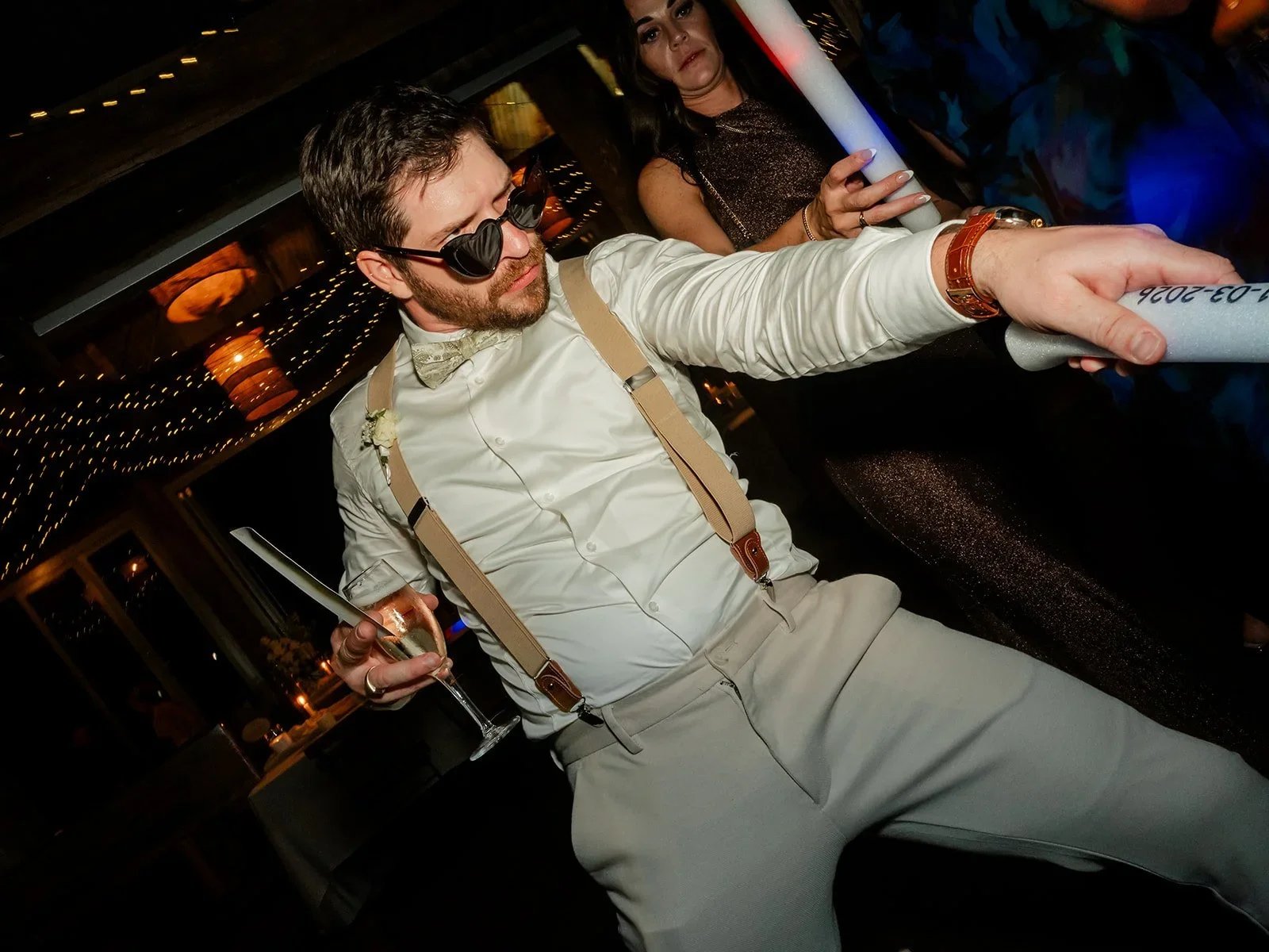 James dancing energetically with glow sticks at the reception — Sean Reefman Photography