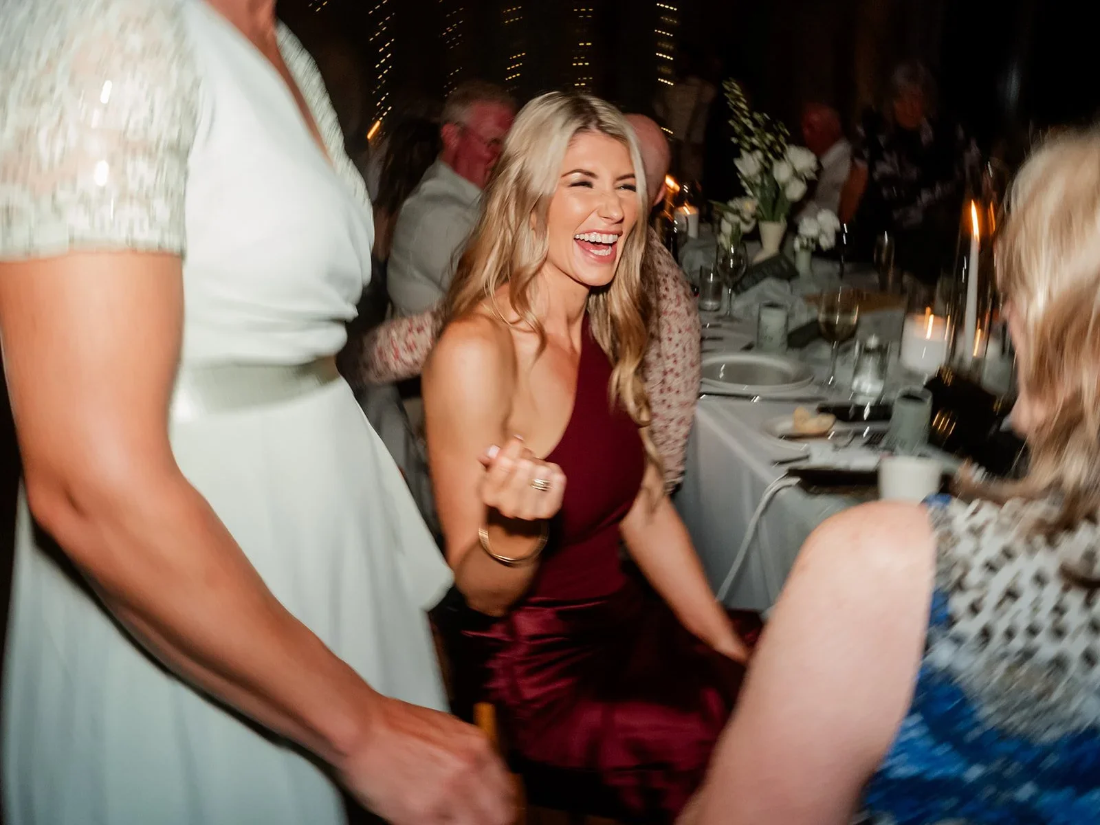 A bridesmaid laughing candidly during the reception — Sean Reefman Photography