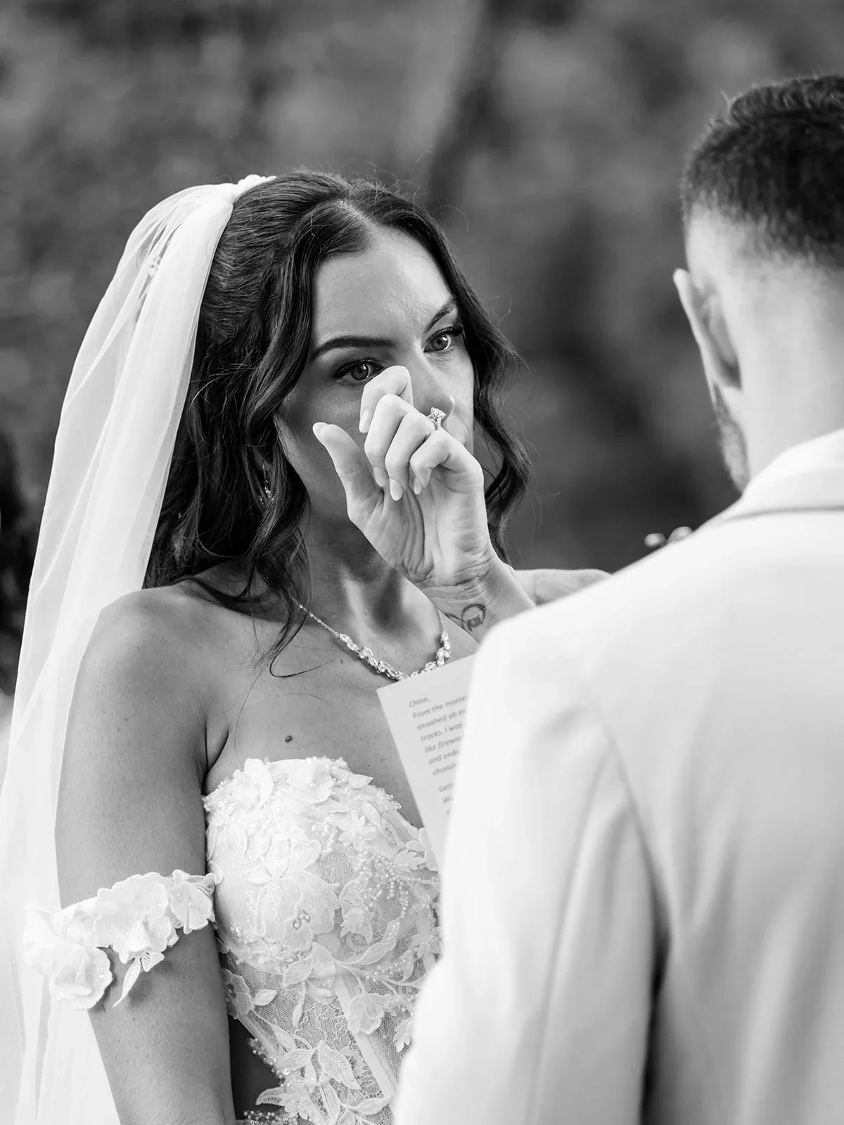 Chloe wiping away a tear during an emotional moment in the ceremony — Sean Reefman Photography