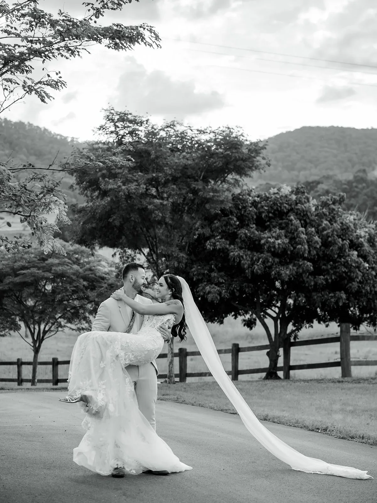 Chloe seated with her dress and veil spread out in black and white — Sean Reefman Photography