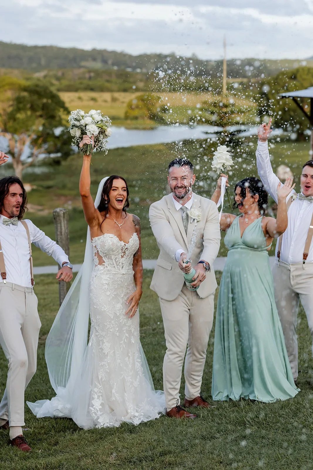 Bridal party cheering and celebrating together after the ceremony — Sean Reefman Photography