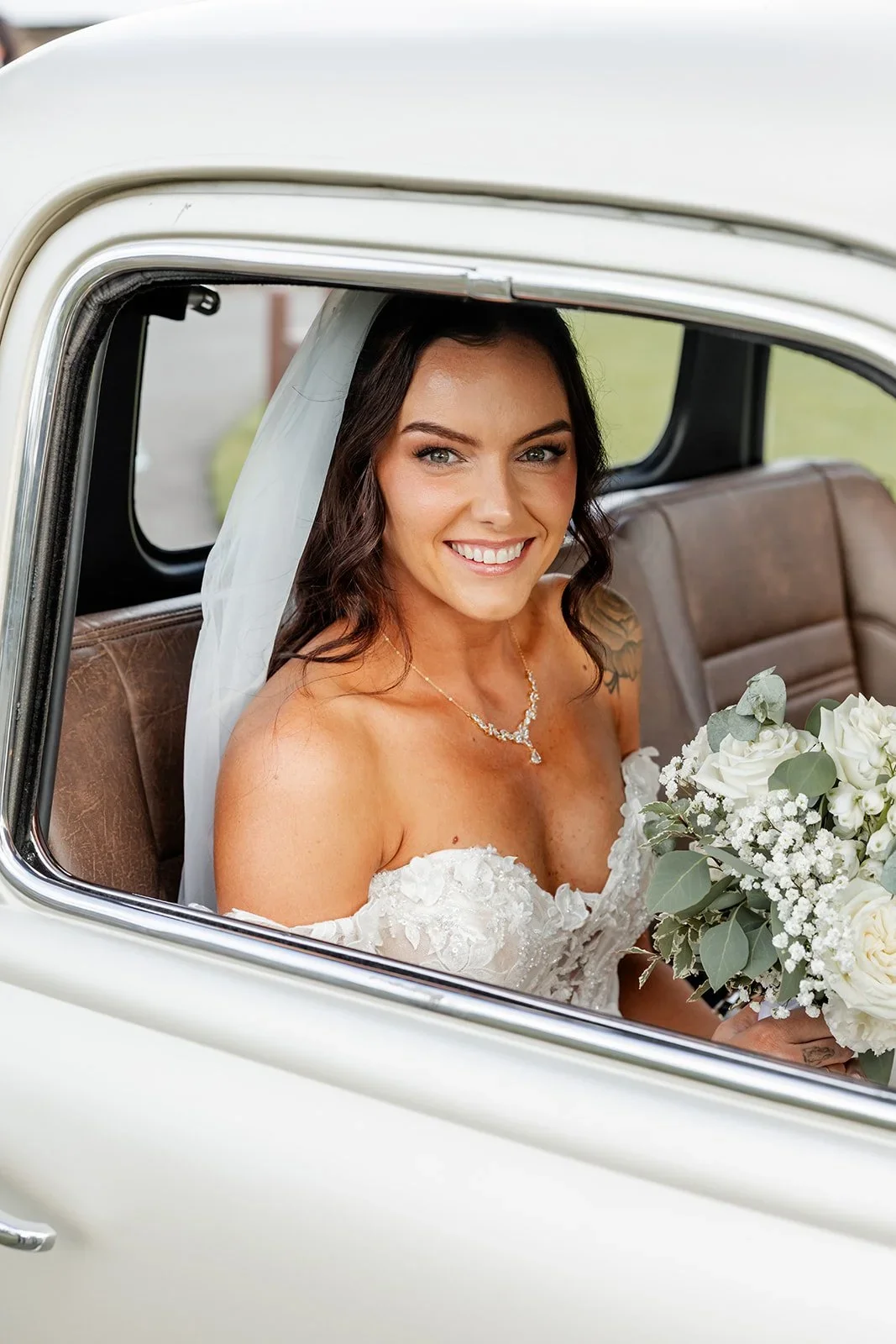 Chloe smiling from the car window as she arrives for the ceremony — Sean Reefman Photography