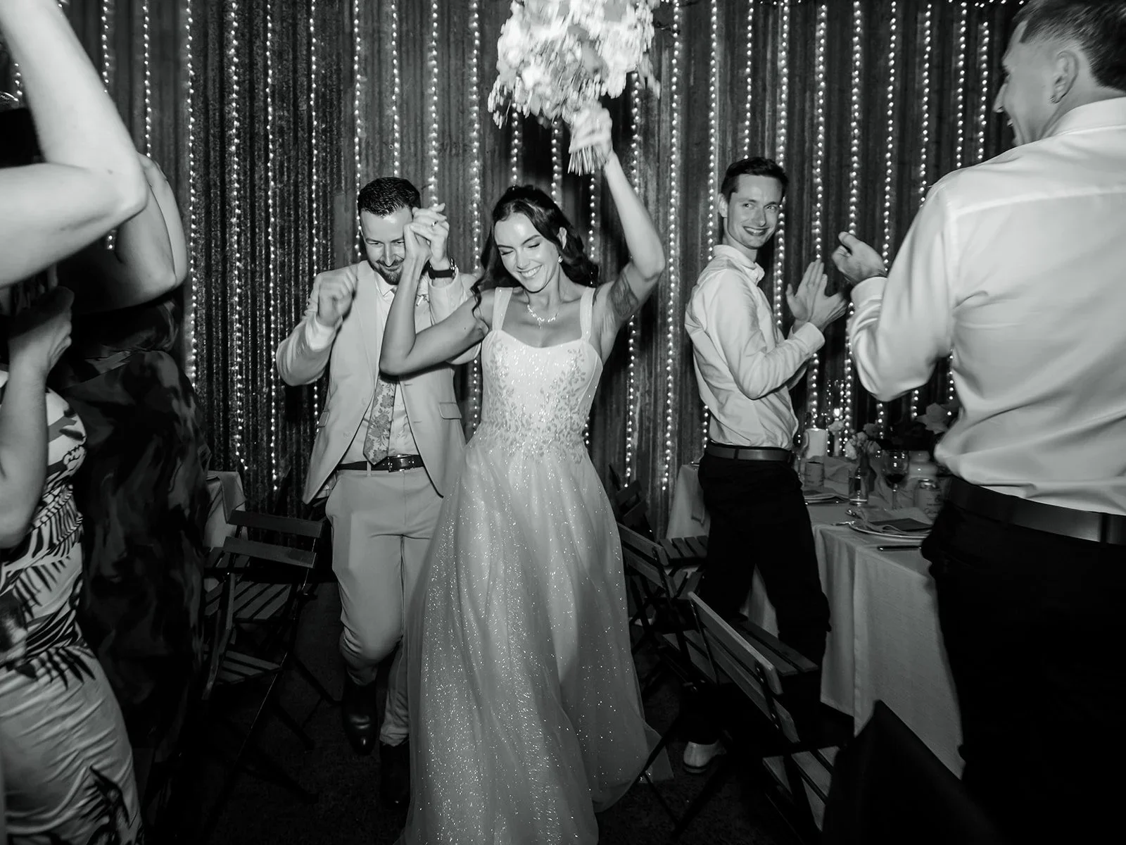 Chloe and guests cheering and dancing at the reception — Sean Reefman Photography