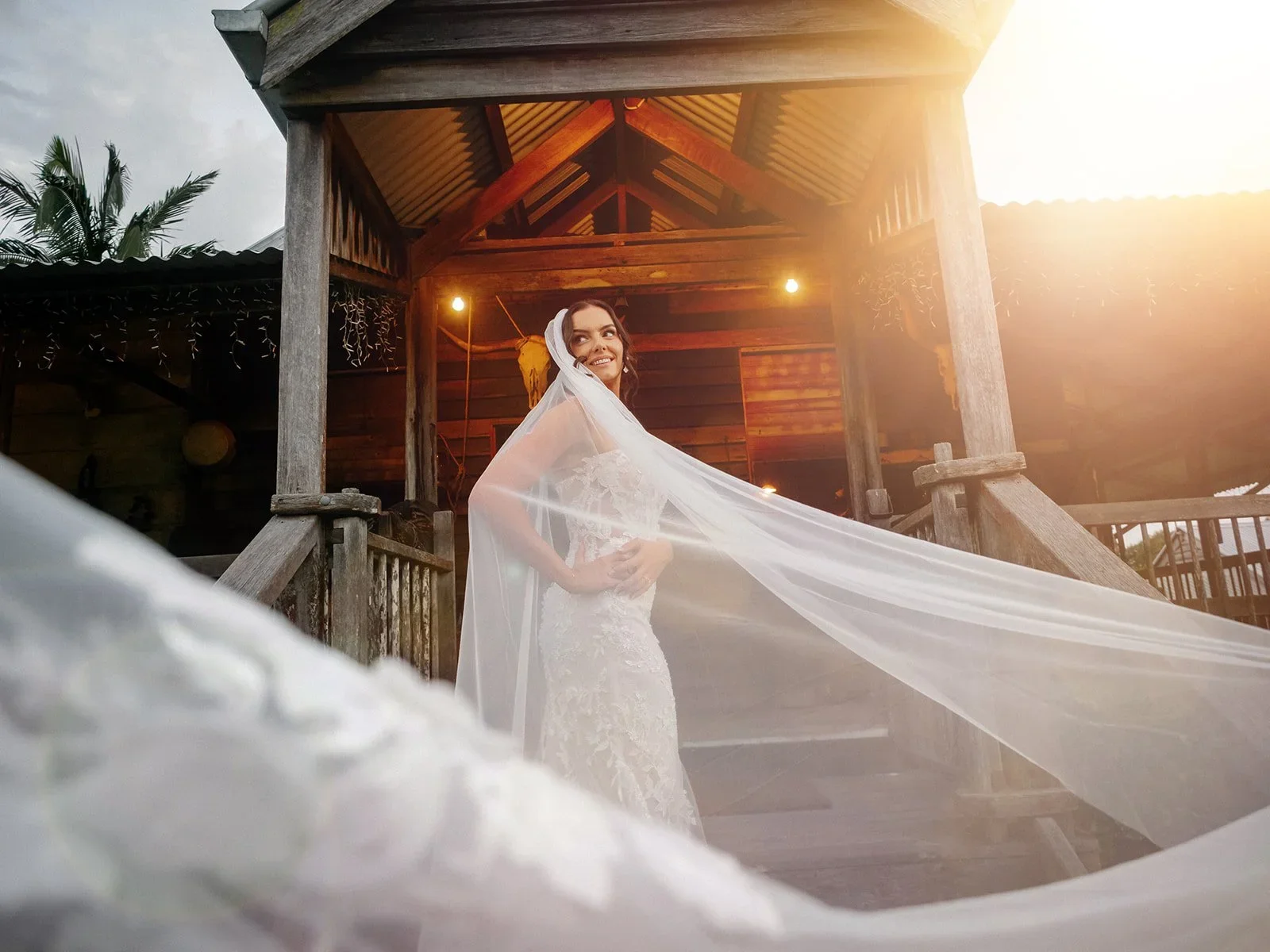 Chloe's veil catching the golden sunset light near the venue — Sean Reefman Photography