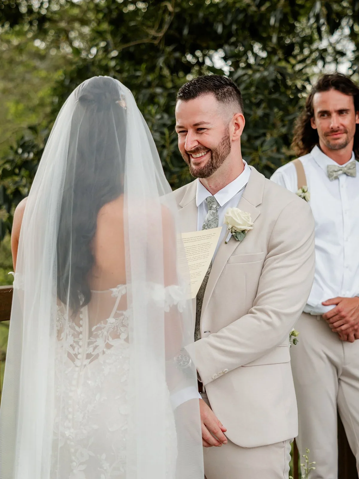 James watching Chloe walk down the aisle, surrounded by groomsmen — Sean Reefman Photography