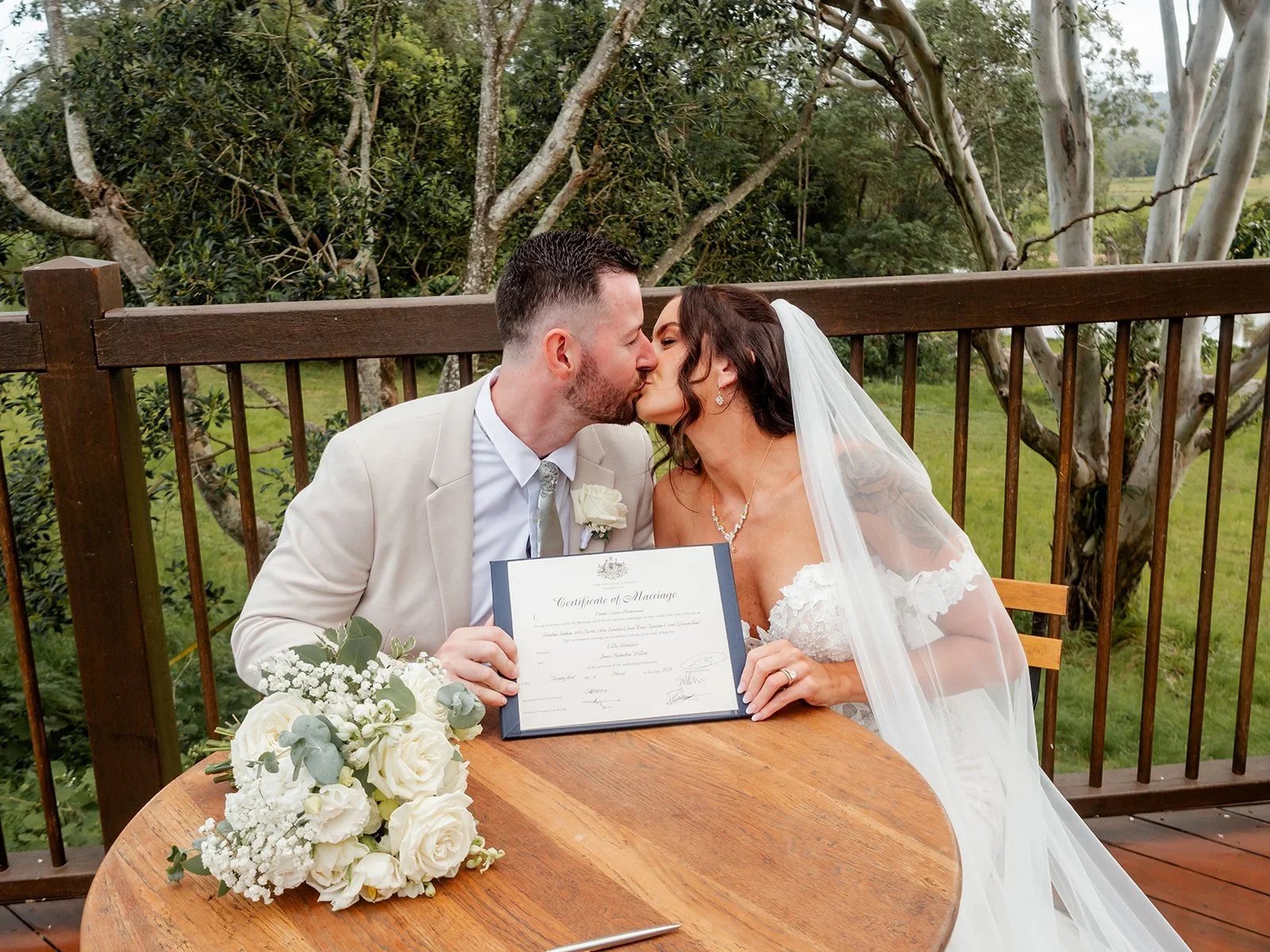 Chloe and James laughing together at the signing table — Sean Reefman Photography