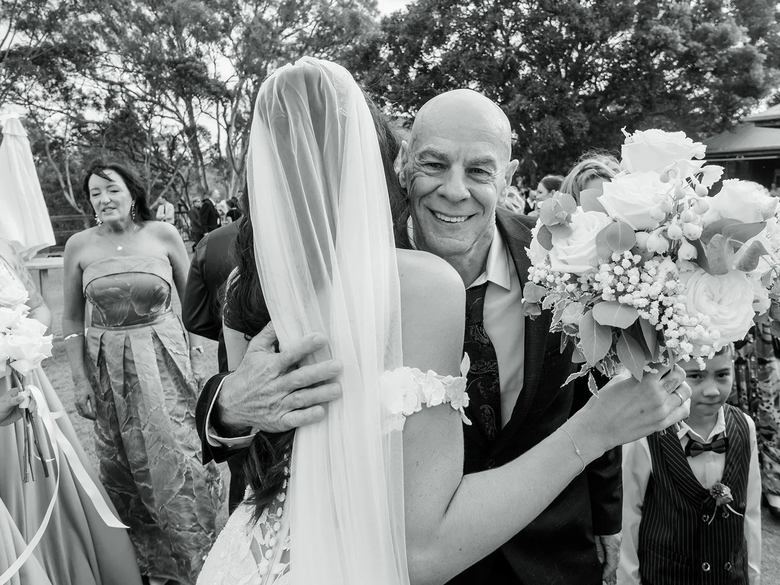 Chloe's father embracing her after the ceremony in black and white — Sean Reefman Photography
