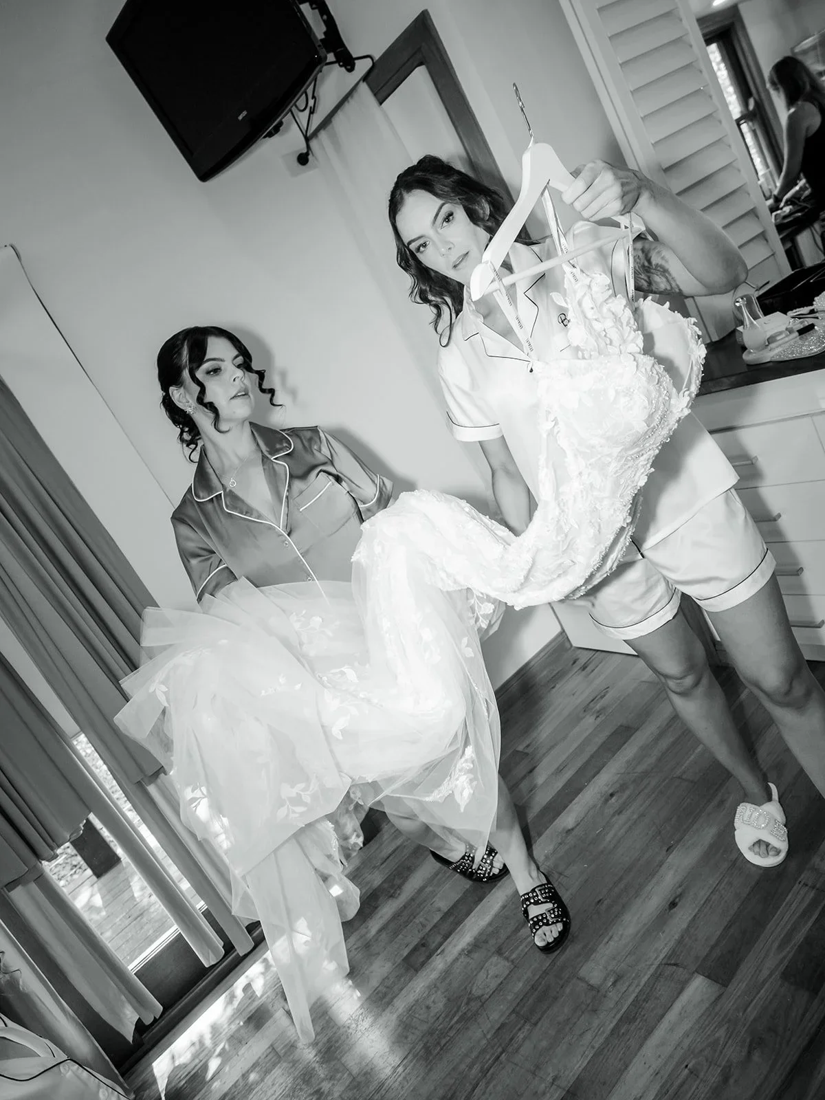 Chloe twirling in her wedding dress while getting ready in black and white — Sean Reefman Photography