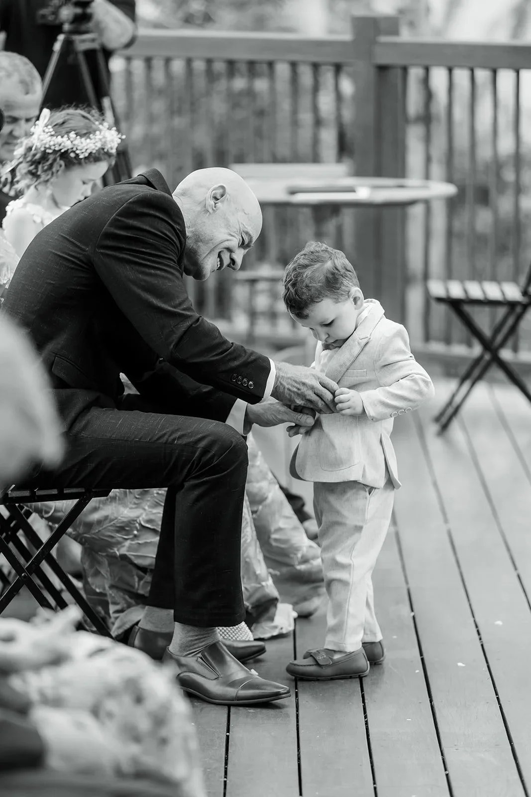 James sitting with the ring bearer before the ceremony in black and white — Sean Reefman Photography