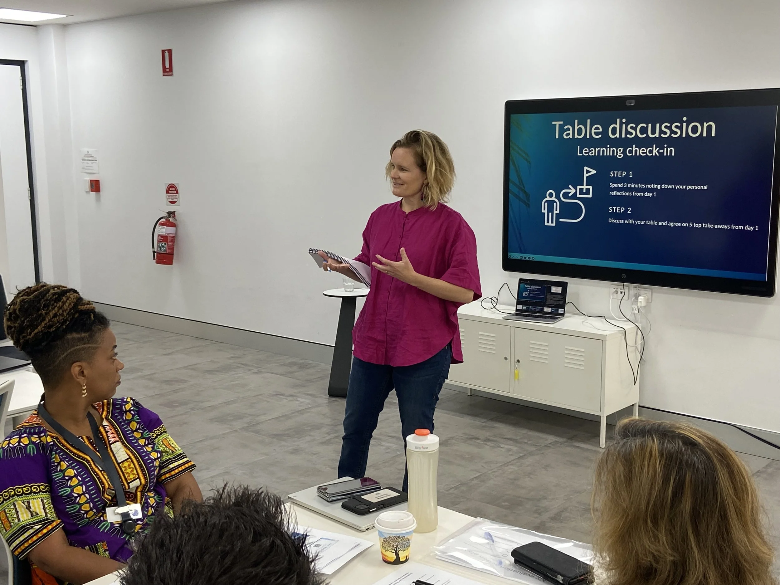 Person standing and presenting information 