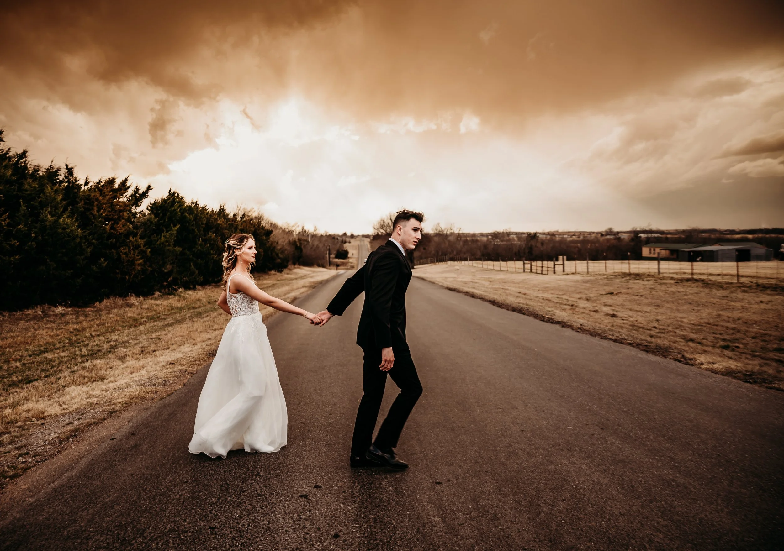 Wedding photographer couple walking across the street best Oklahoma wedding photographer