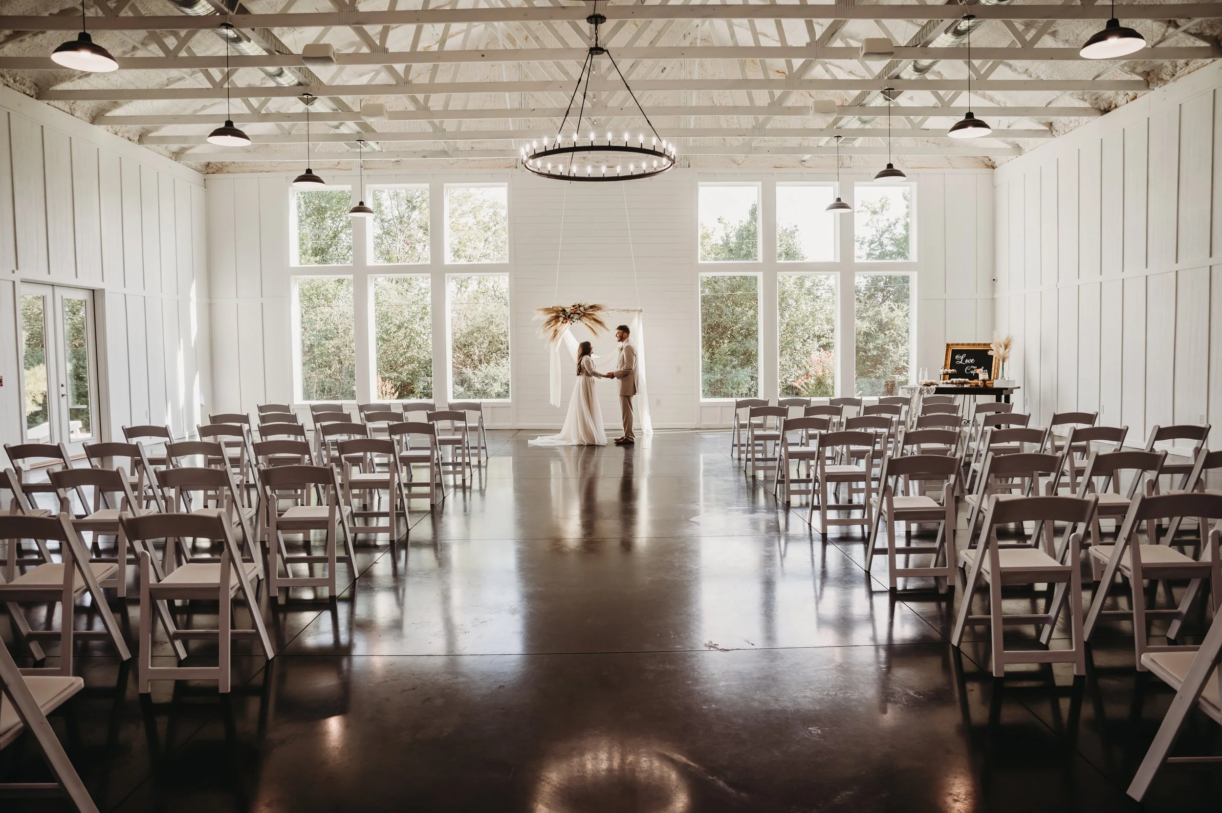 Muskogee Oklahoma wedding , couple, holding hands in venue