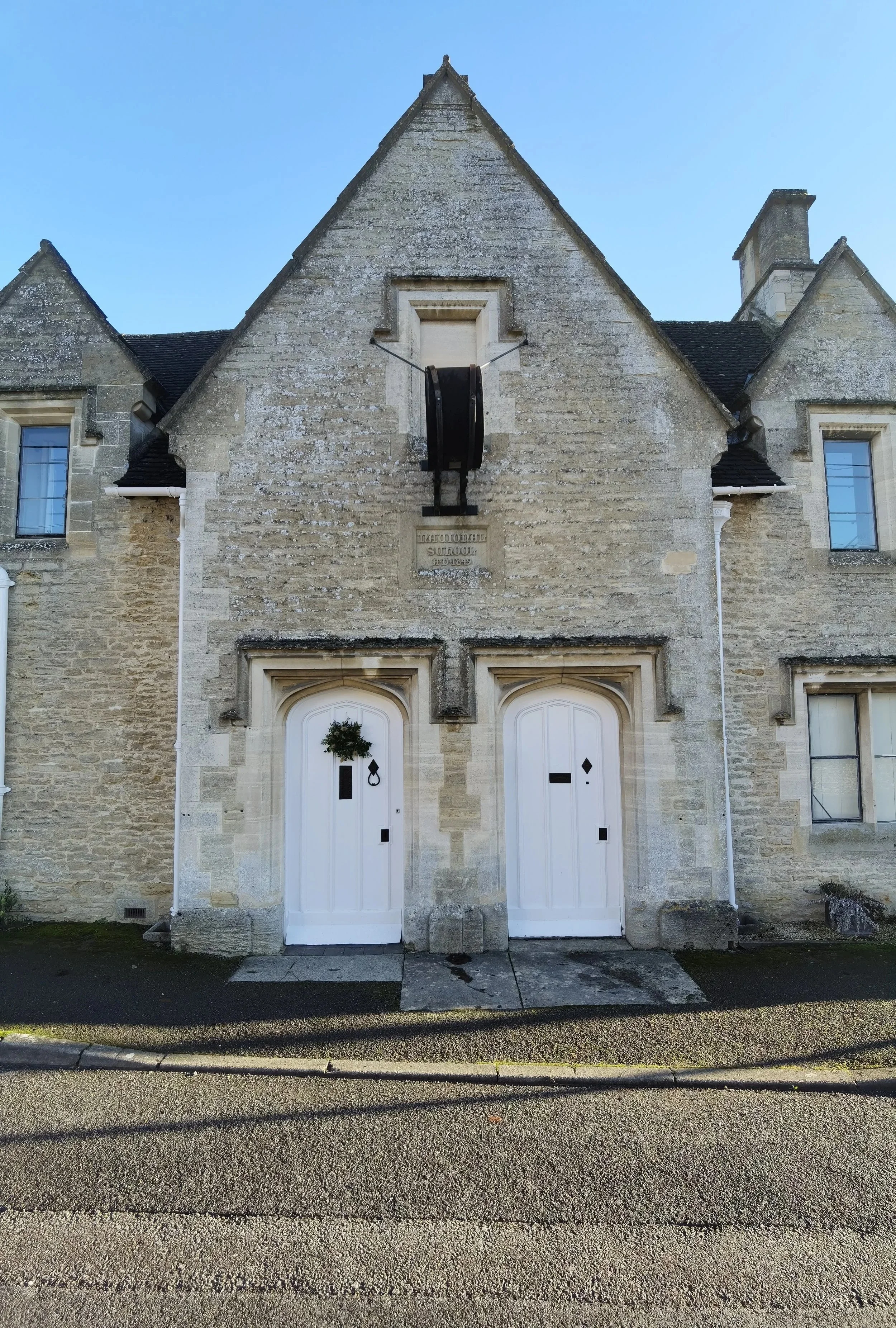 Old ‘Nacional School A.D. 1849’ (ghost sign under the old school clock) in Coates. Would have had seperate doors for girls and boys but now its a house only one is in use