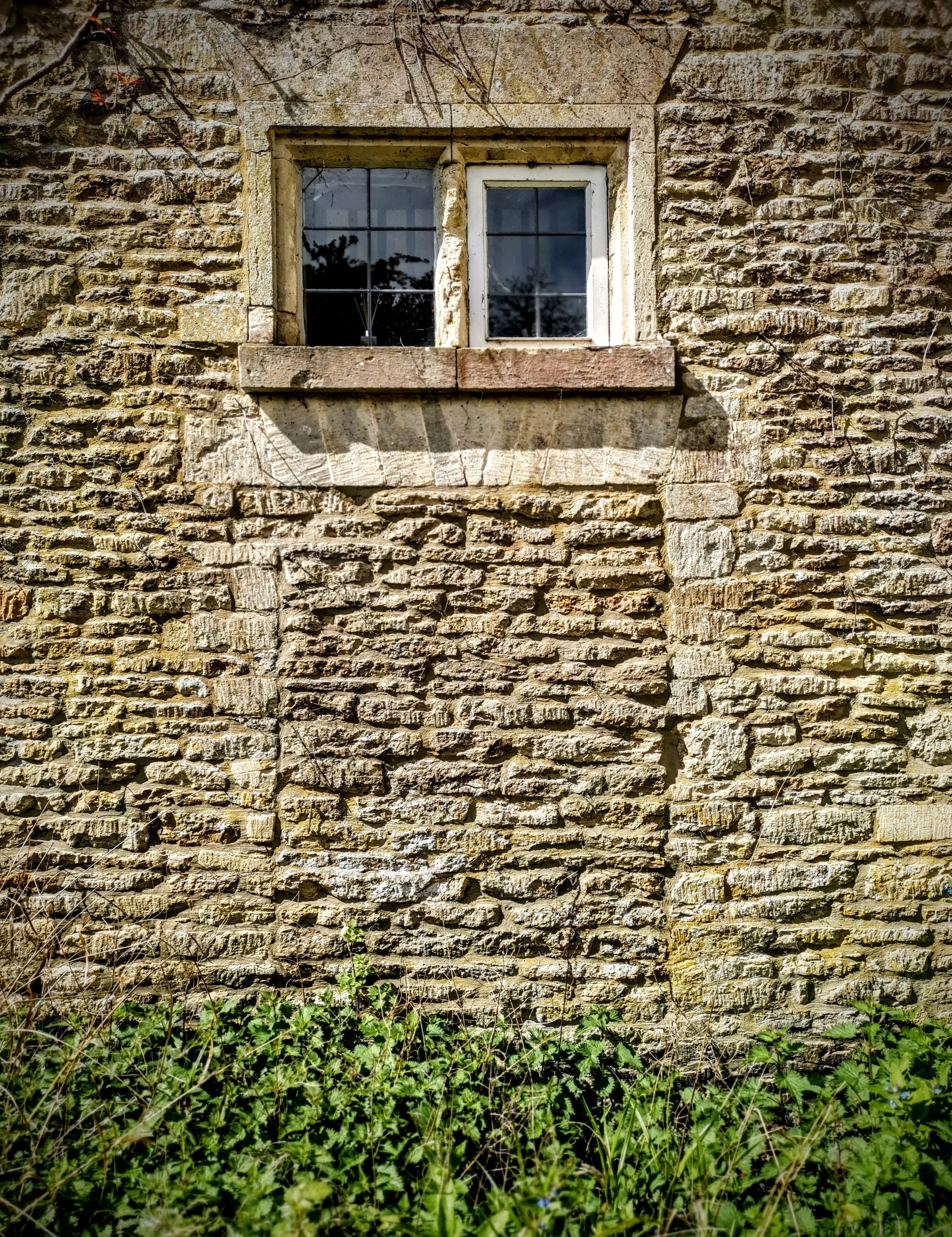 Once a door from the main house into the church yard at the Holy Rood Church in Ampney Crucis