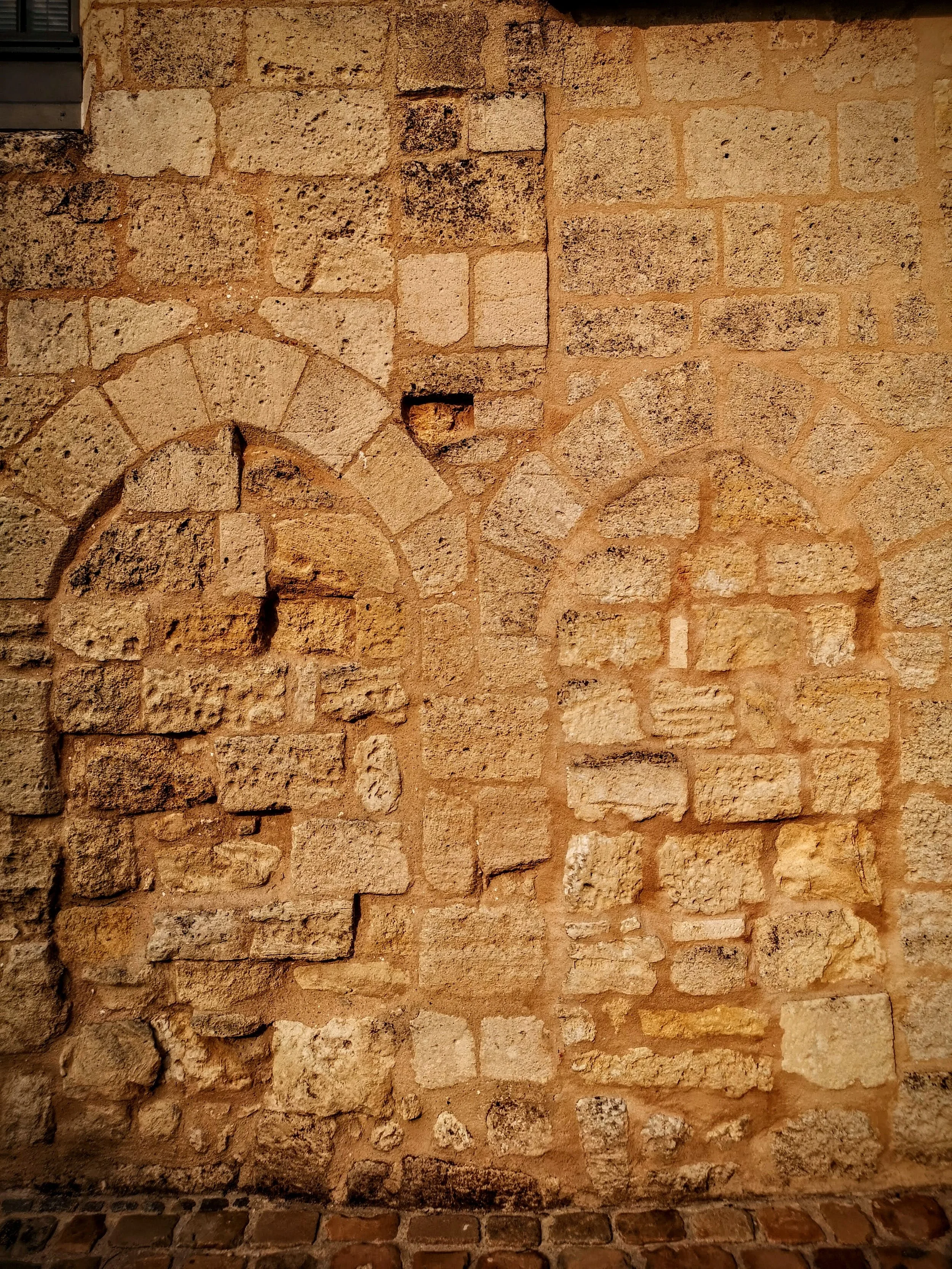 Rare twin ghost doors bathed in the light of the setting sun. St Emilion, France