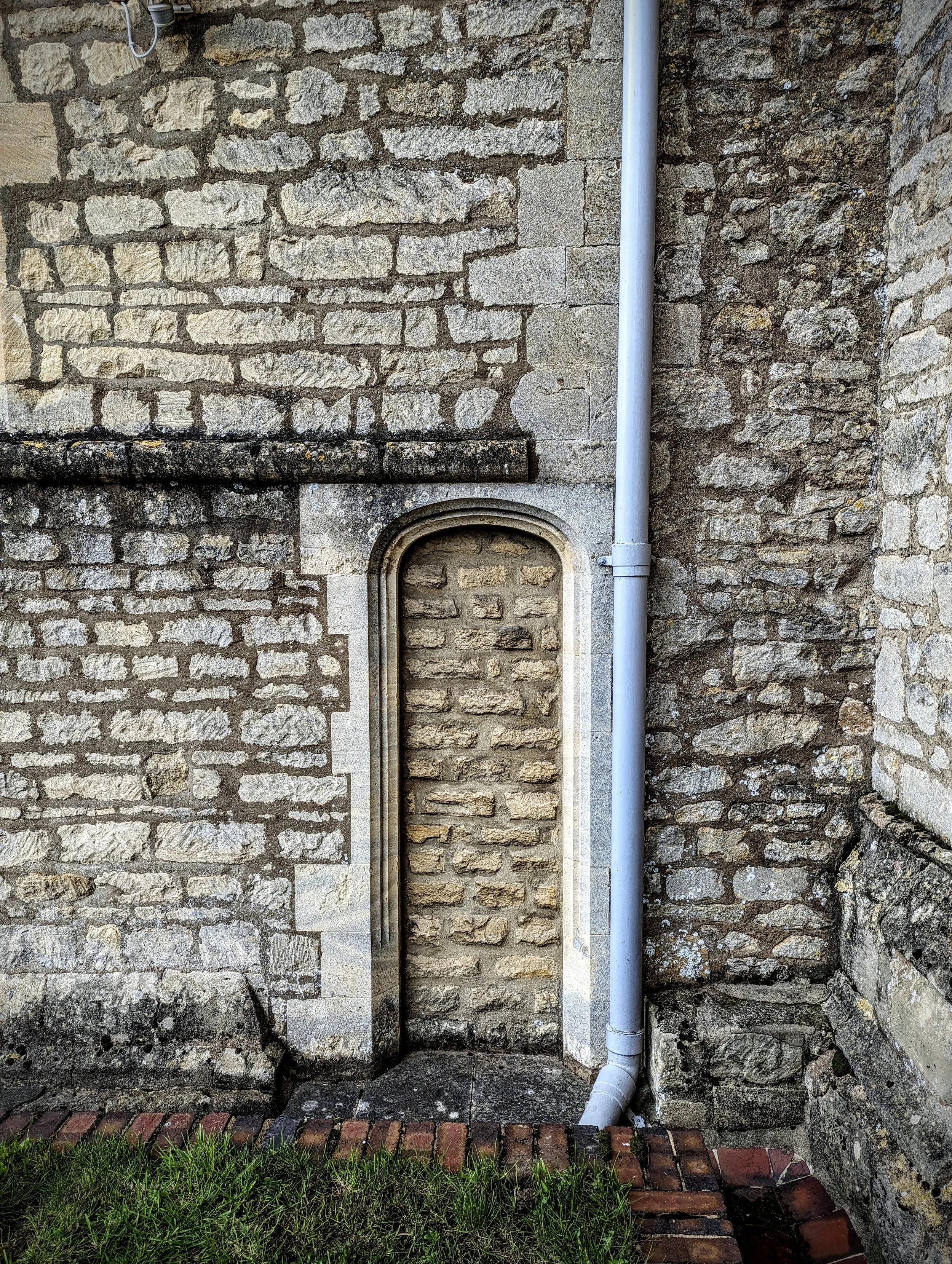 Smaller door, possibly originally for bellringers or the organist, at the back of St Giles Church in Bredon