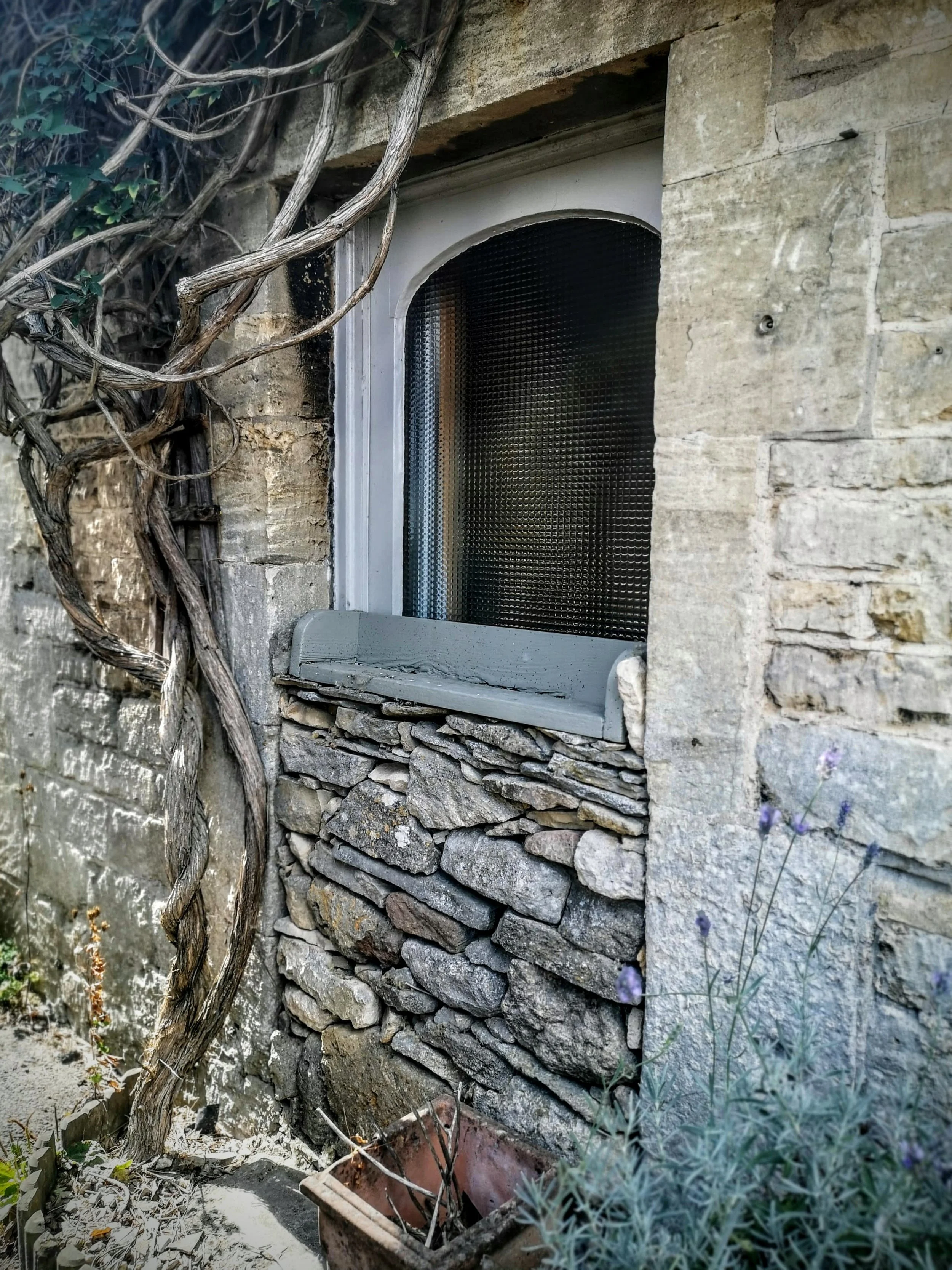 Walled up Cotswold doorway in Guiting Power