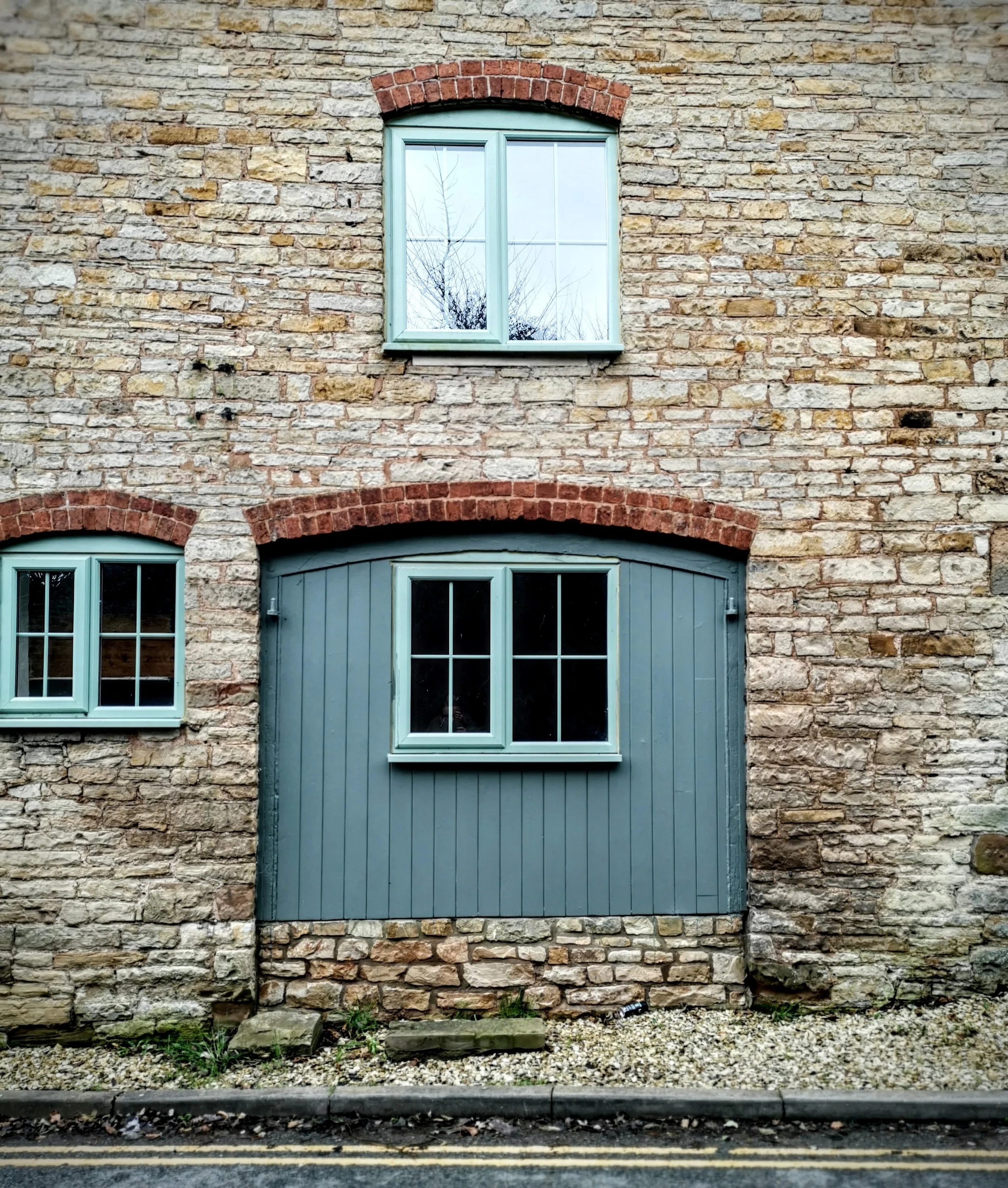 A different take: on coach house door converted to this. You can see the old hinges