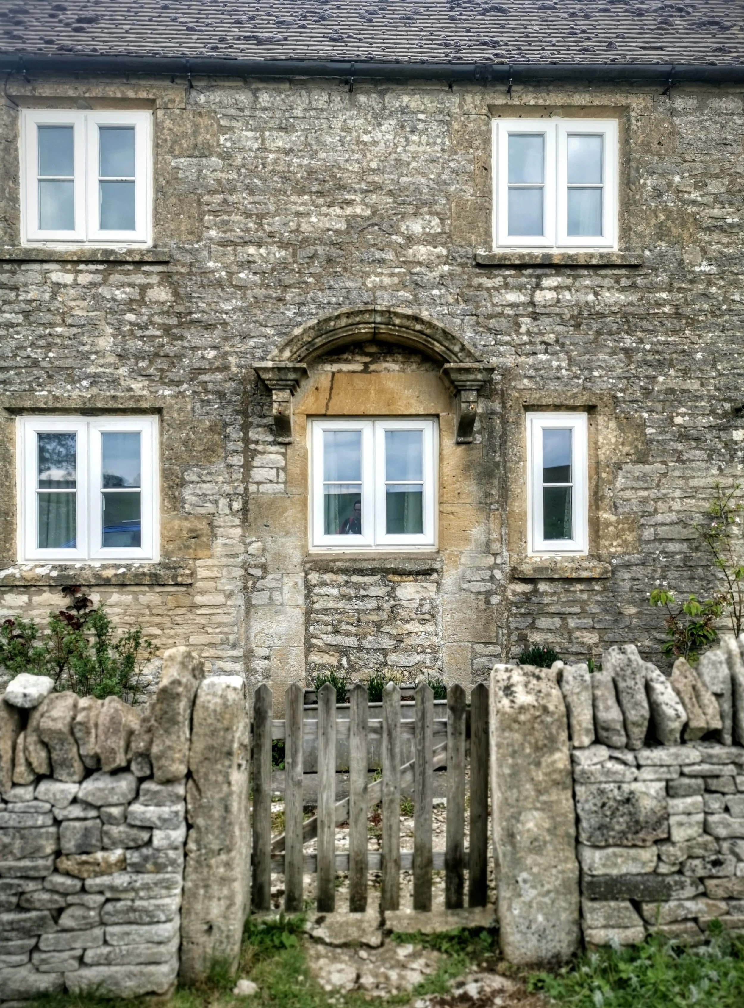 Lonely cottage above Charlton Abbots in the Cotswolds. Was two houses made into one