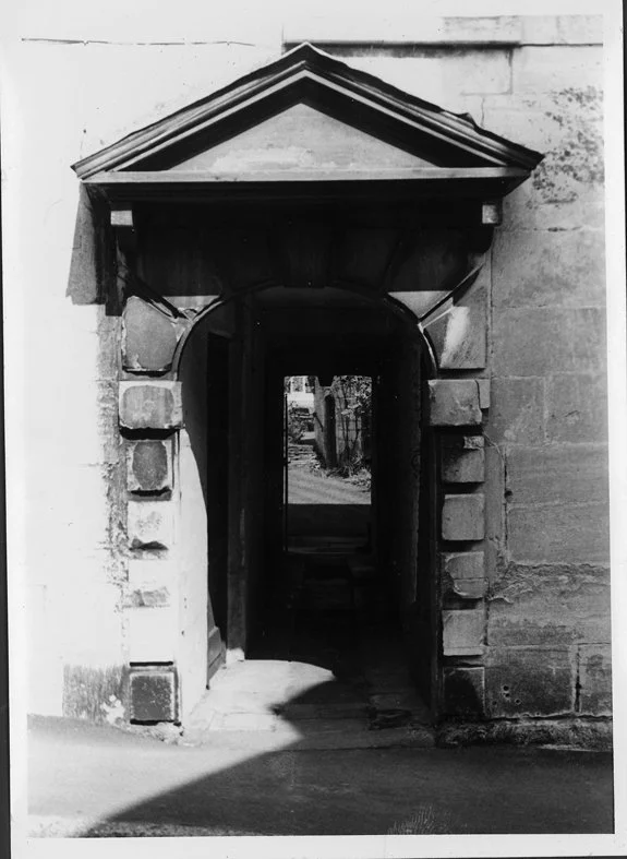 The same door in yesteryear, showing the passgeway to the rear of the house