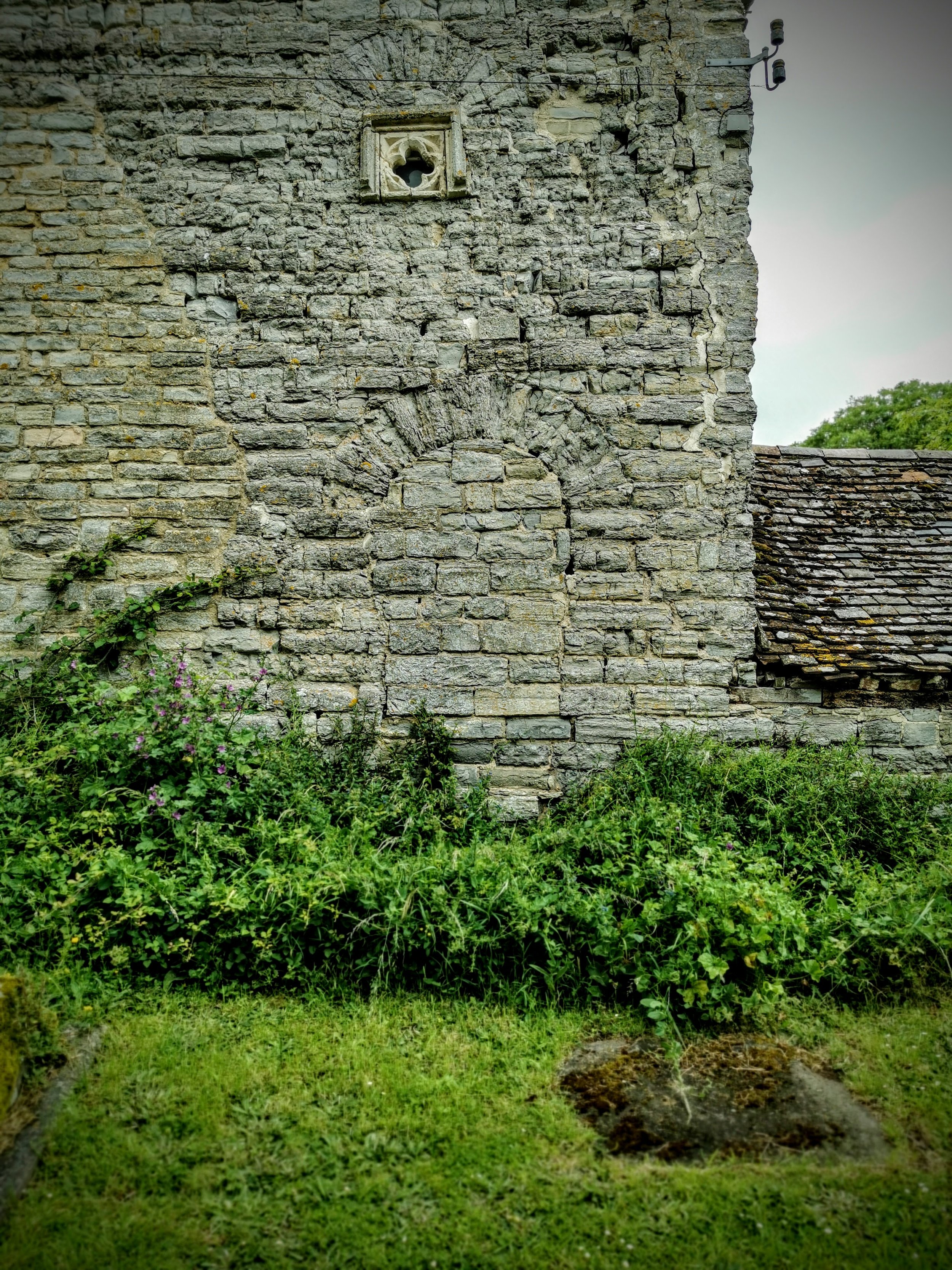 This is at the end of a medieval house next to the Church at Ashleworth in Gloucestershire