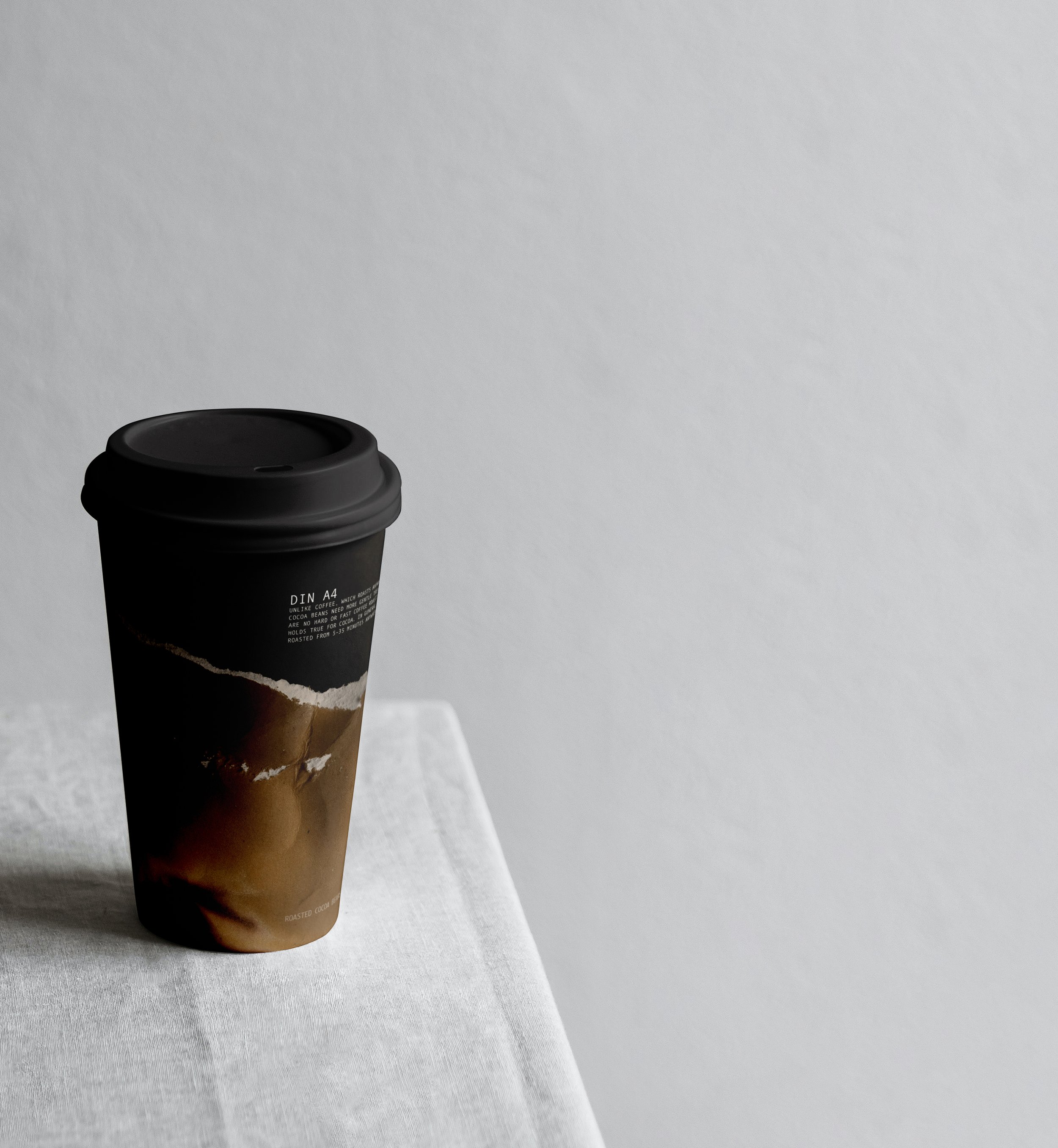 Free Paper Coffee Cup with MacBook Mockup.jpg