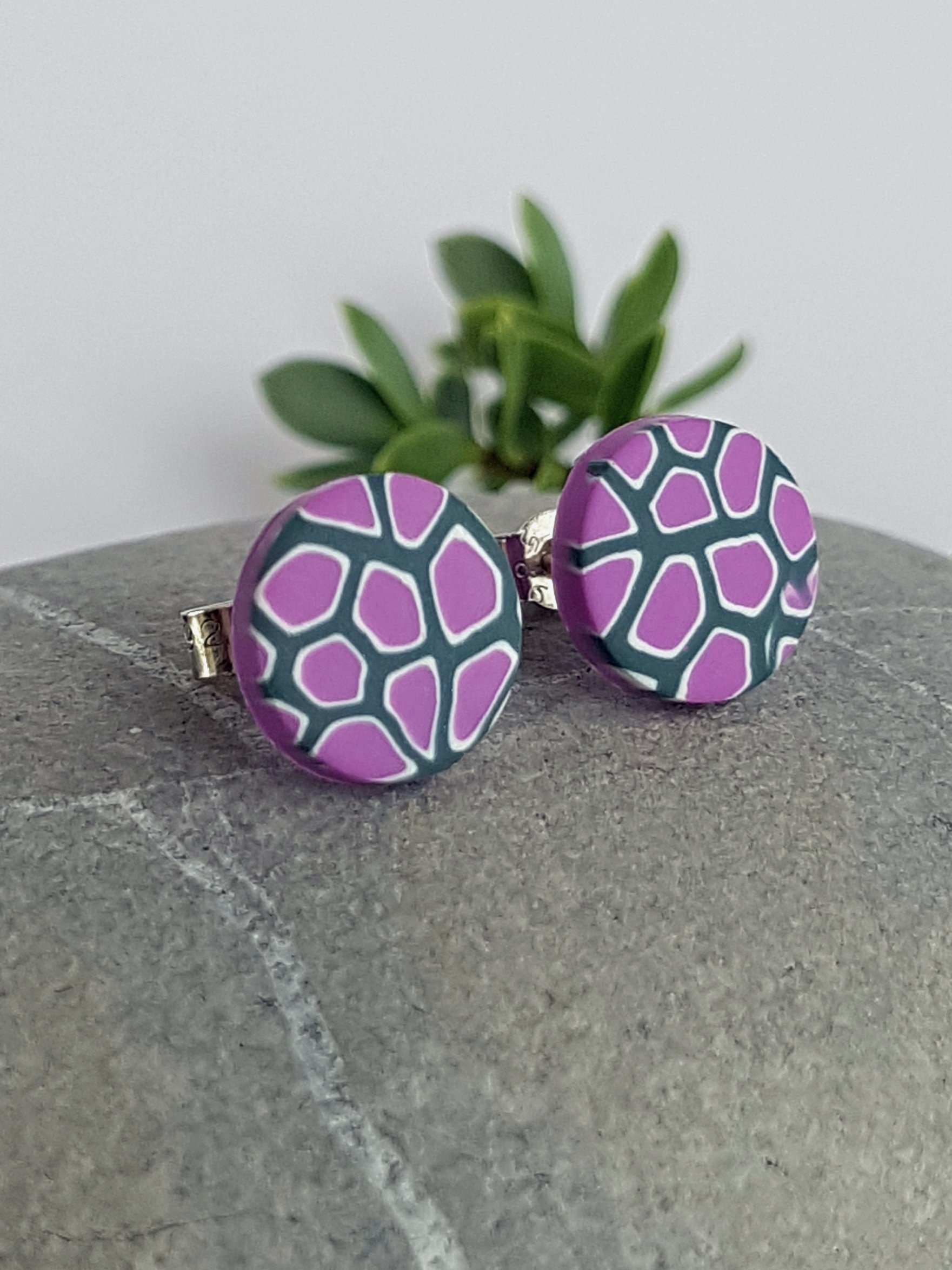 Lightweight, smooth, flat, lilac, white and grey stud earrings with lilac backs and sterling silver posts and scrolls.
